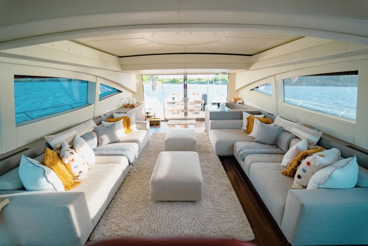 Luxurious interior of a 2007 Mangusta 92 yacht with plush seating and elegant decor.