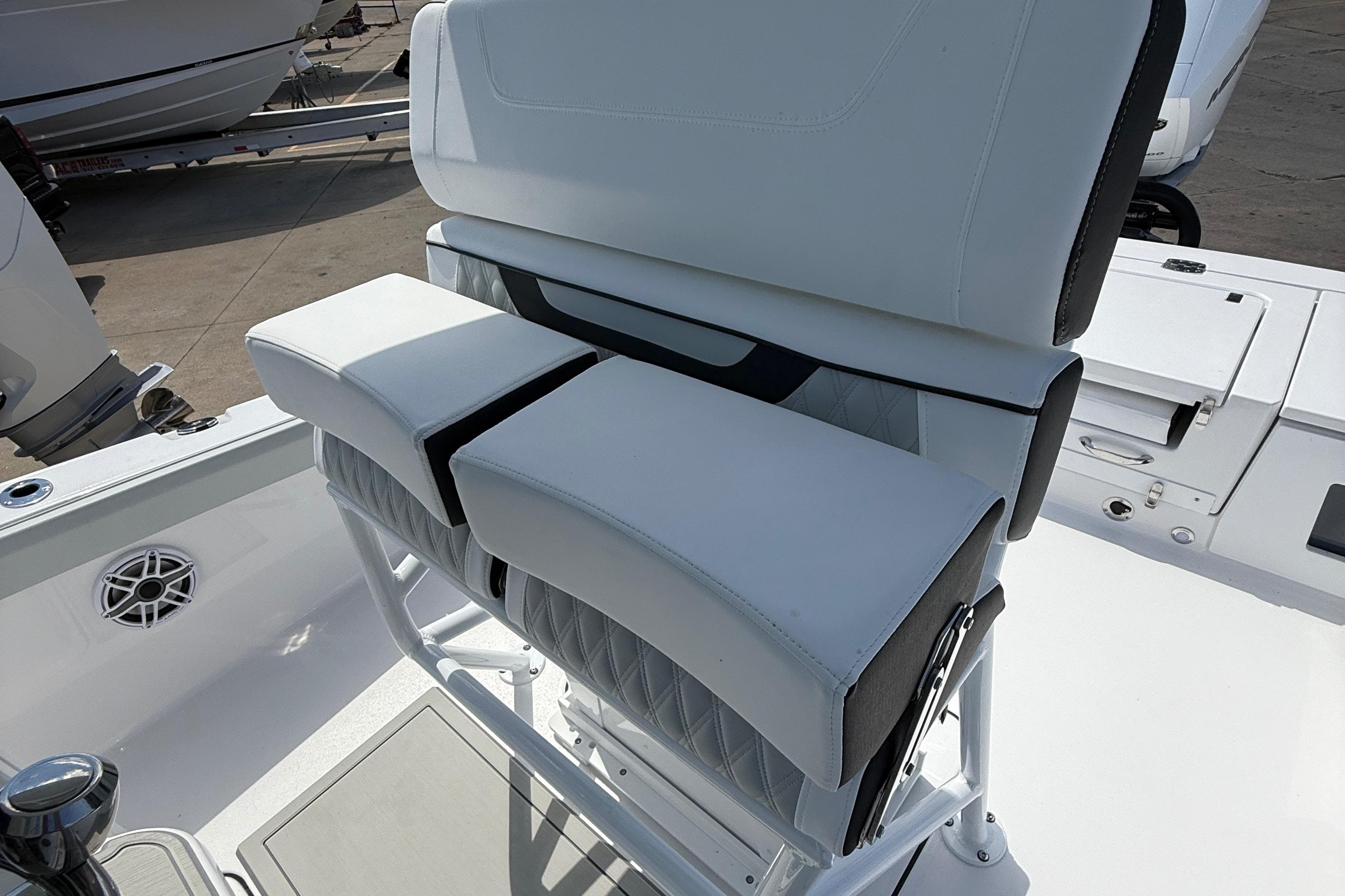 2026 Blackfin 242 HB boat with white cushioned seating and sleek design.