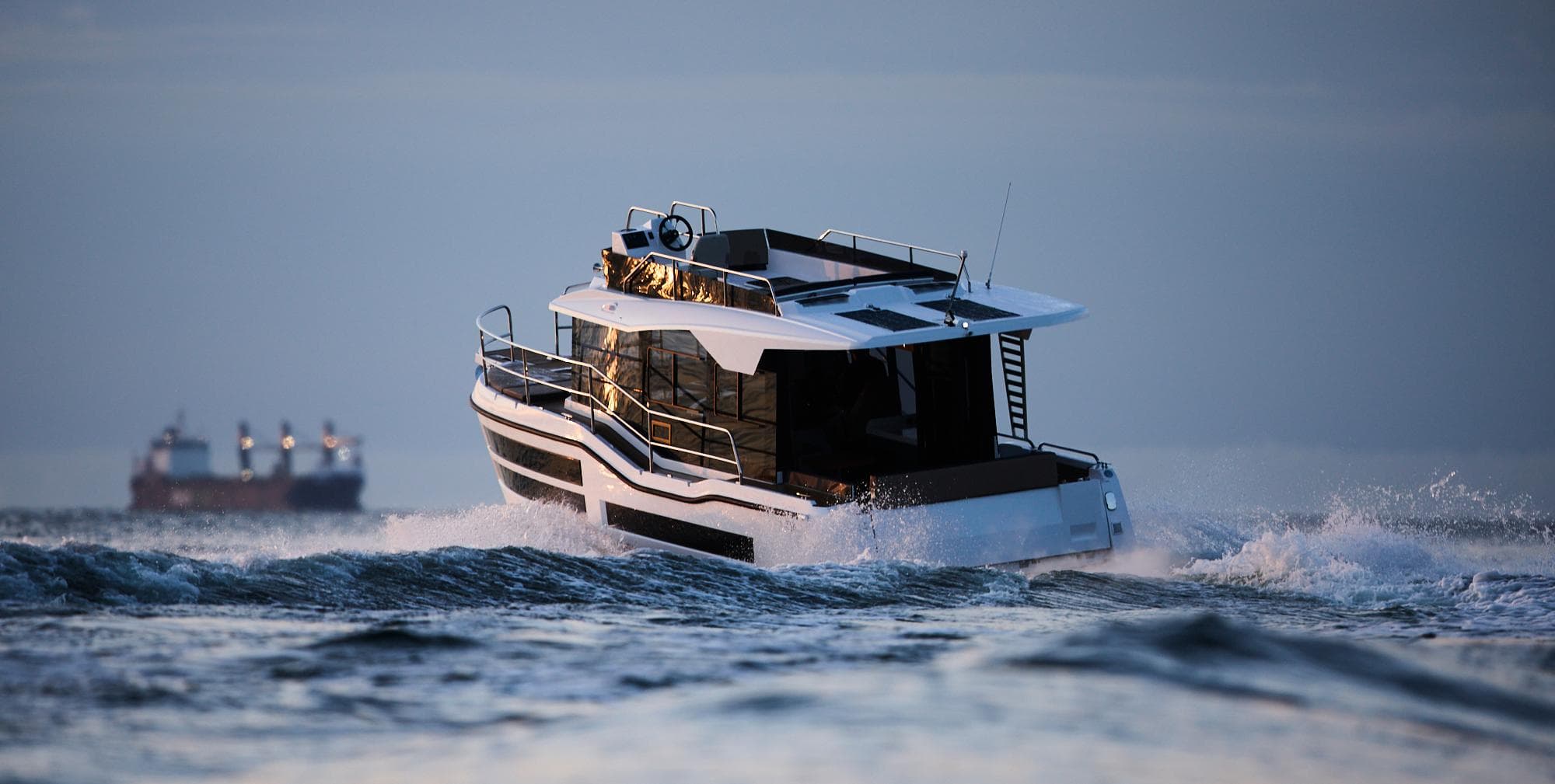 Northman 1050 boat cruising on open water, 2025 model, with distant ships in background.