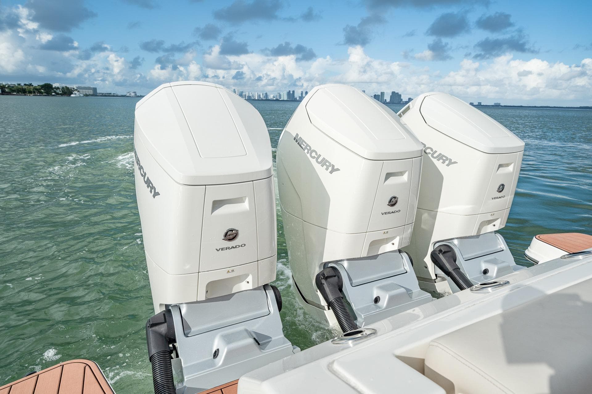 Triple Mercury Verado engines on a 2024 Boston Whaler 405 Conquest, cruising on open water.