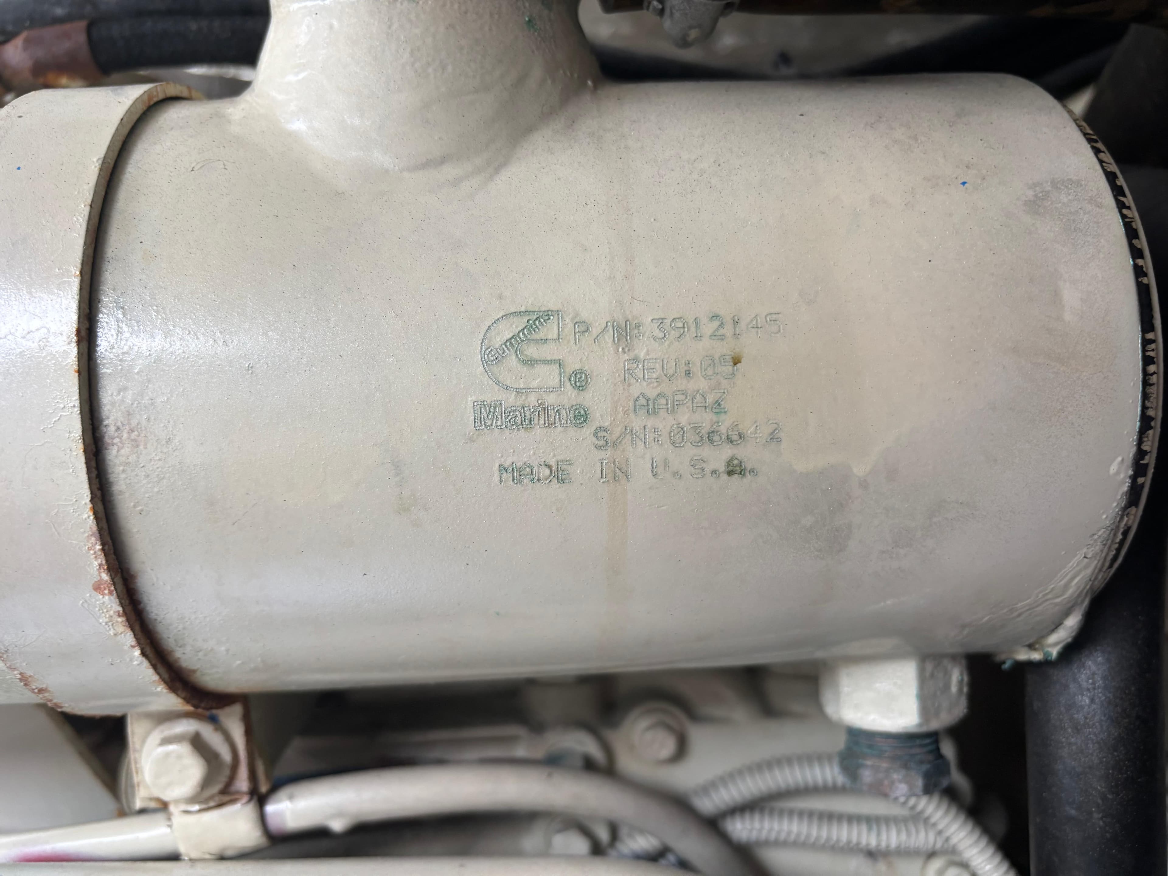 Close-up of a Cummins engine part on a 2002 Sea Ray 450 Express Bridge.