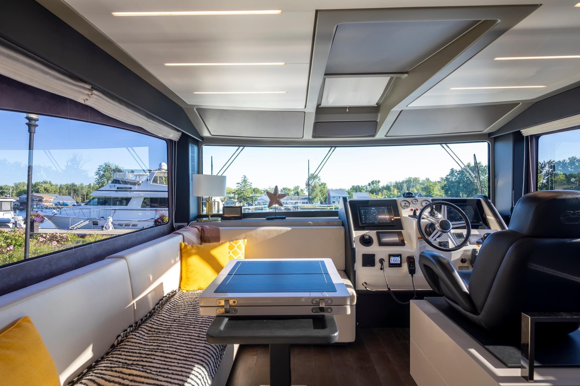 Interior of 2018 Cranchi Eco Trawler 53 Long Distance, featuring helm and seating area.