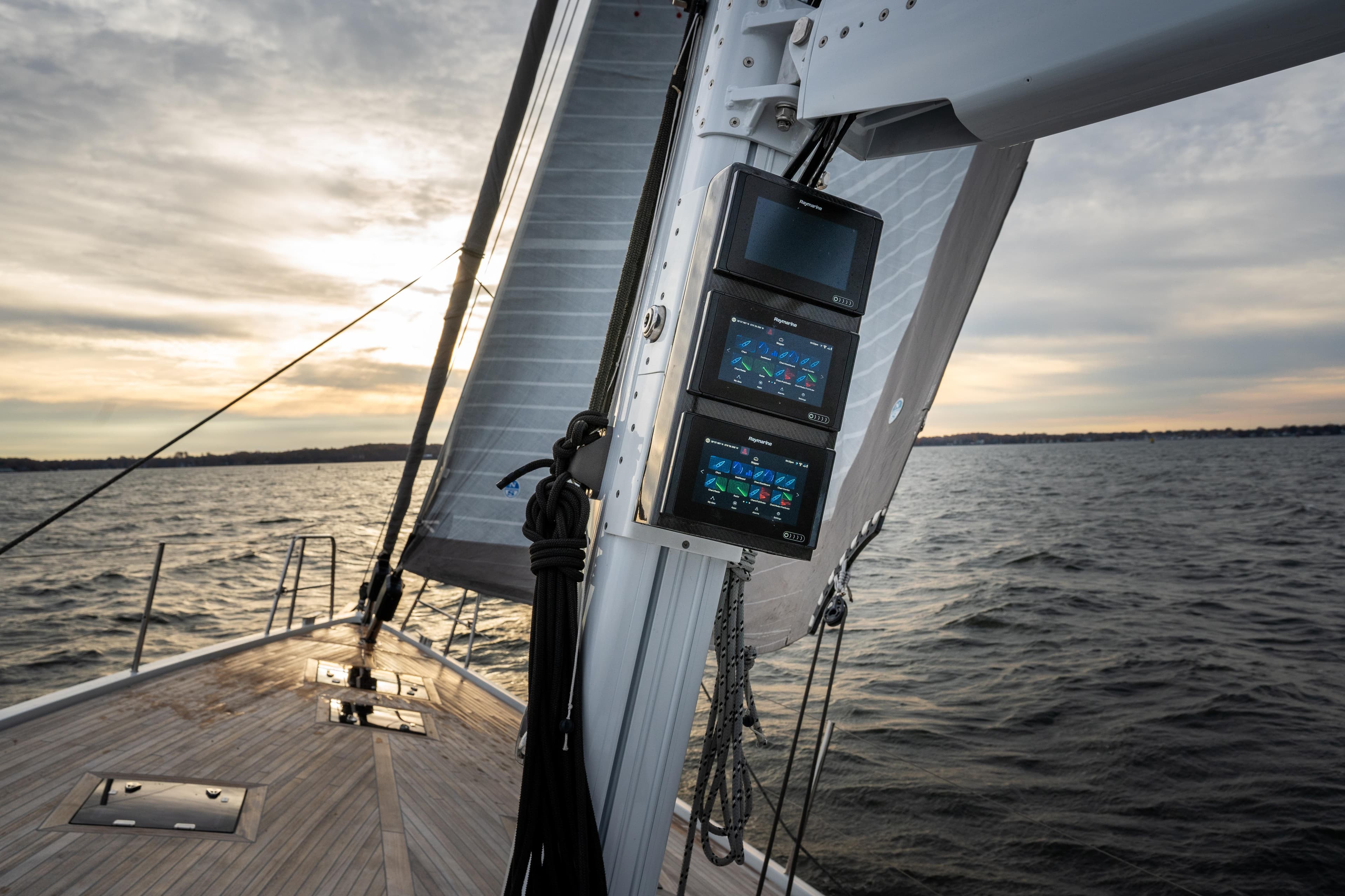 Sailing yacht CNB 66, 2021 model, with advanced navigation displays at sunset.