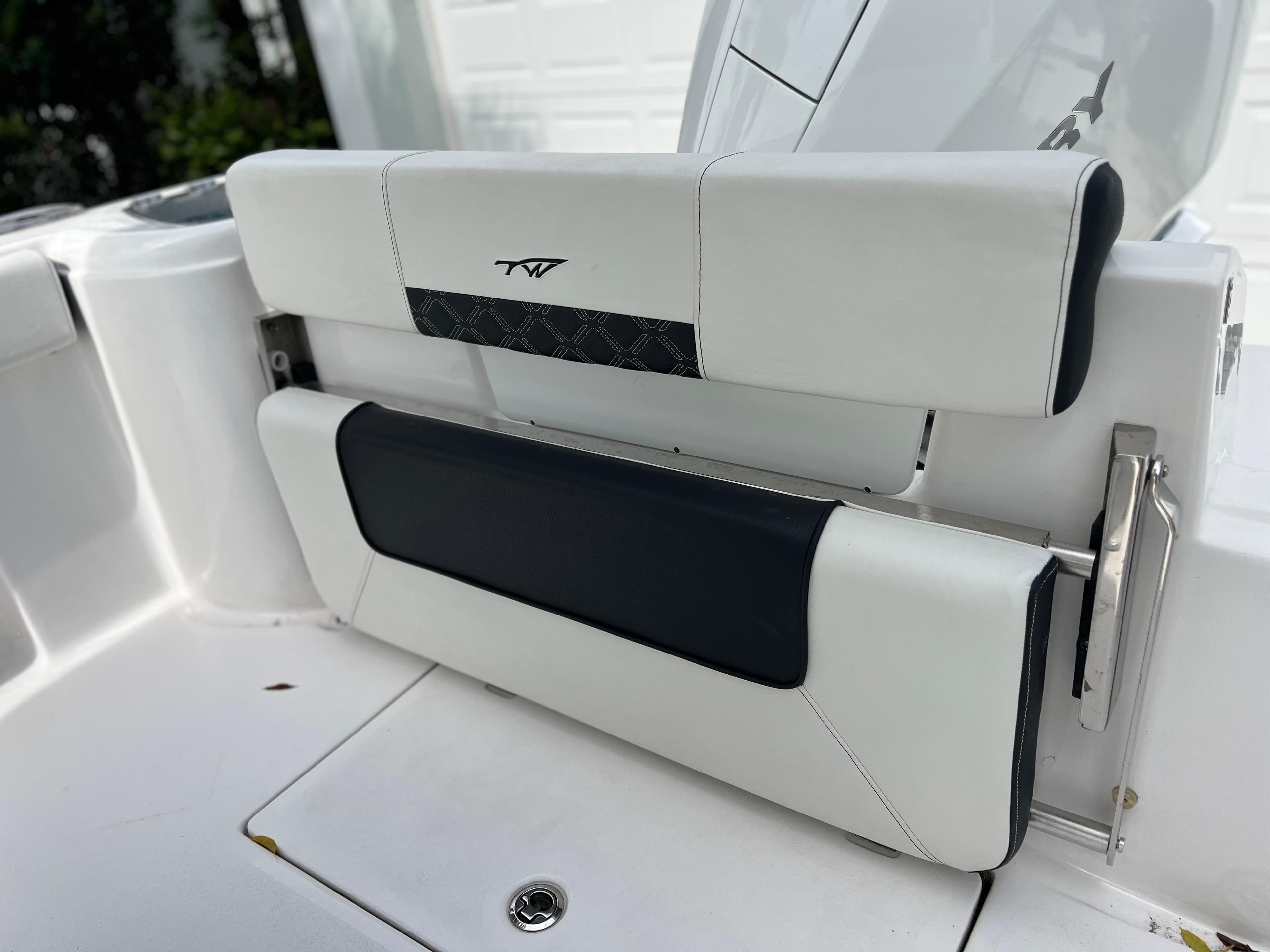 2023 Tidewater 220 CC Adventure boat seat with white and black upholstery.