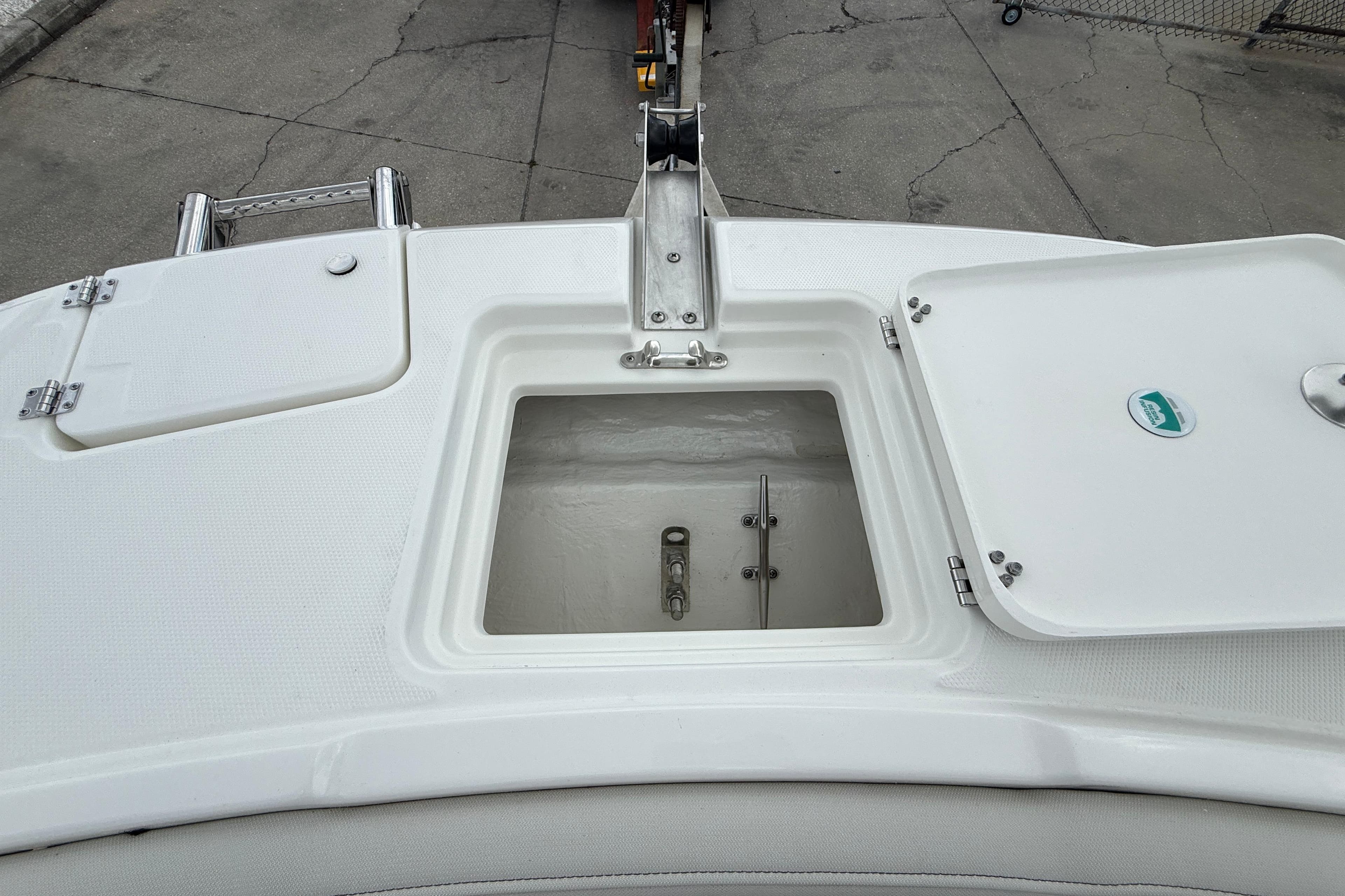 Open storage compartment on 2026 World Cat 230 SD boat deck.