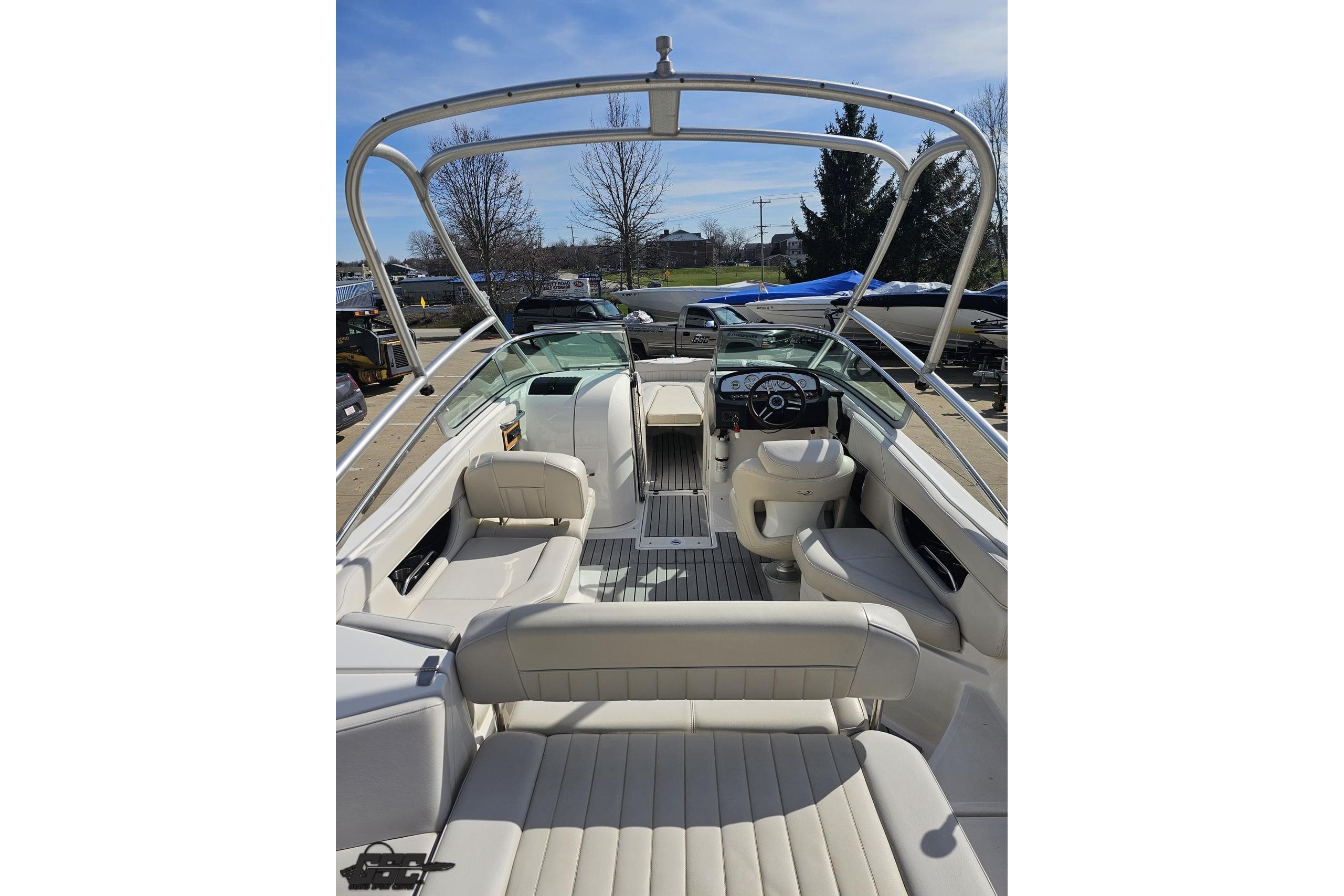 2008 Regal 2520 FasDeck boat interior with white seating and steering console.