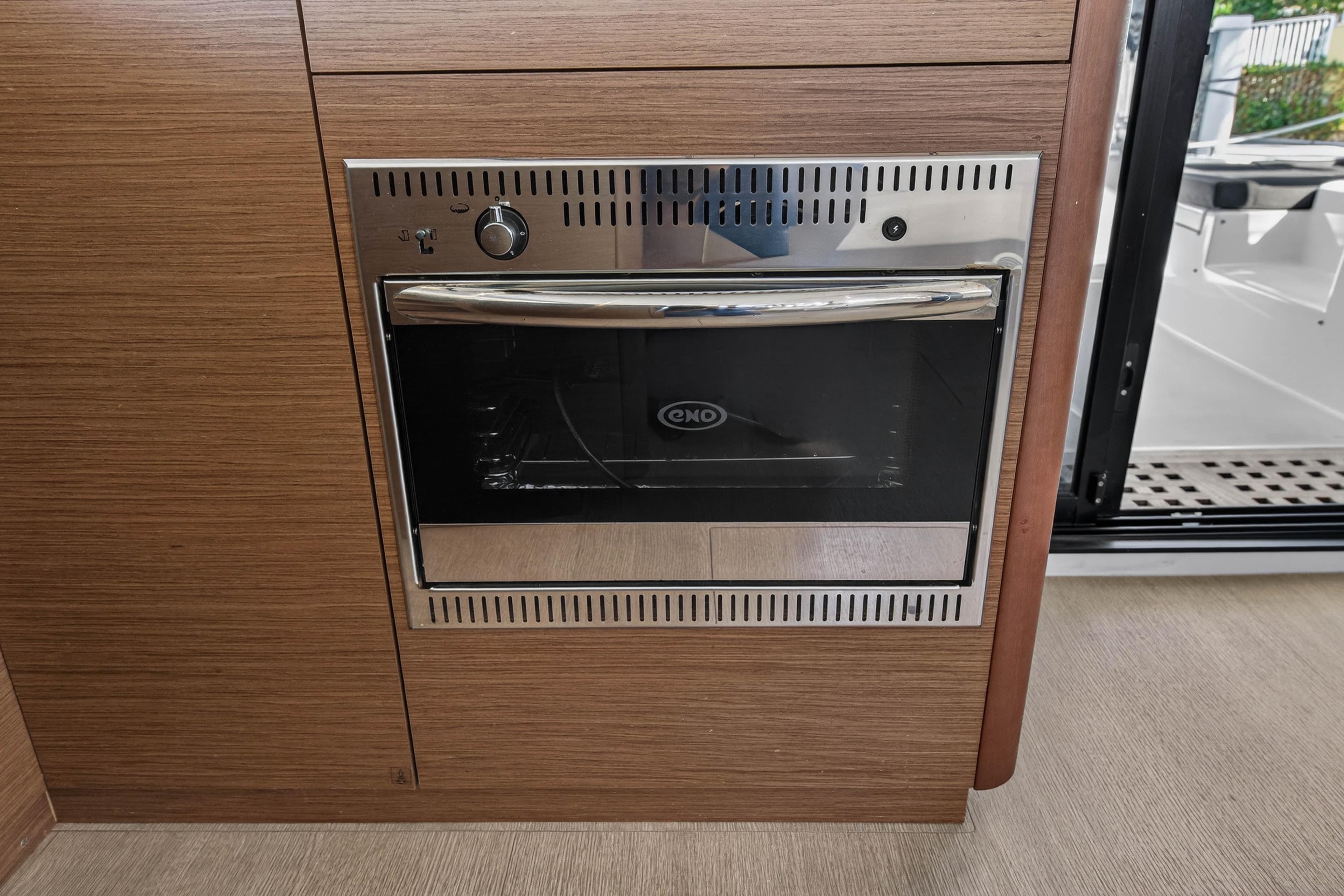 Built-in oven on Lagoon 42 yacht, 2019 model, with wooden cabinetry.