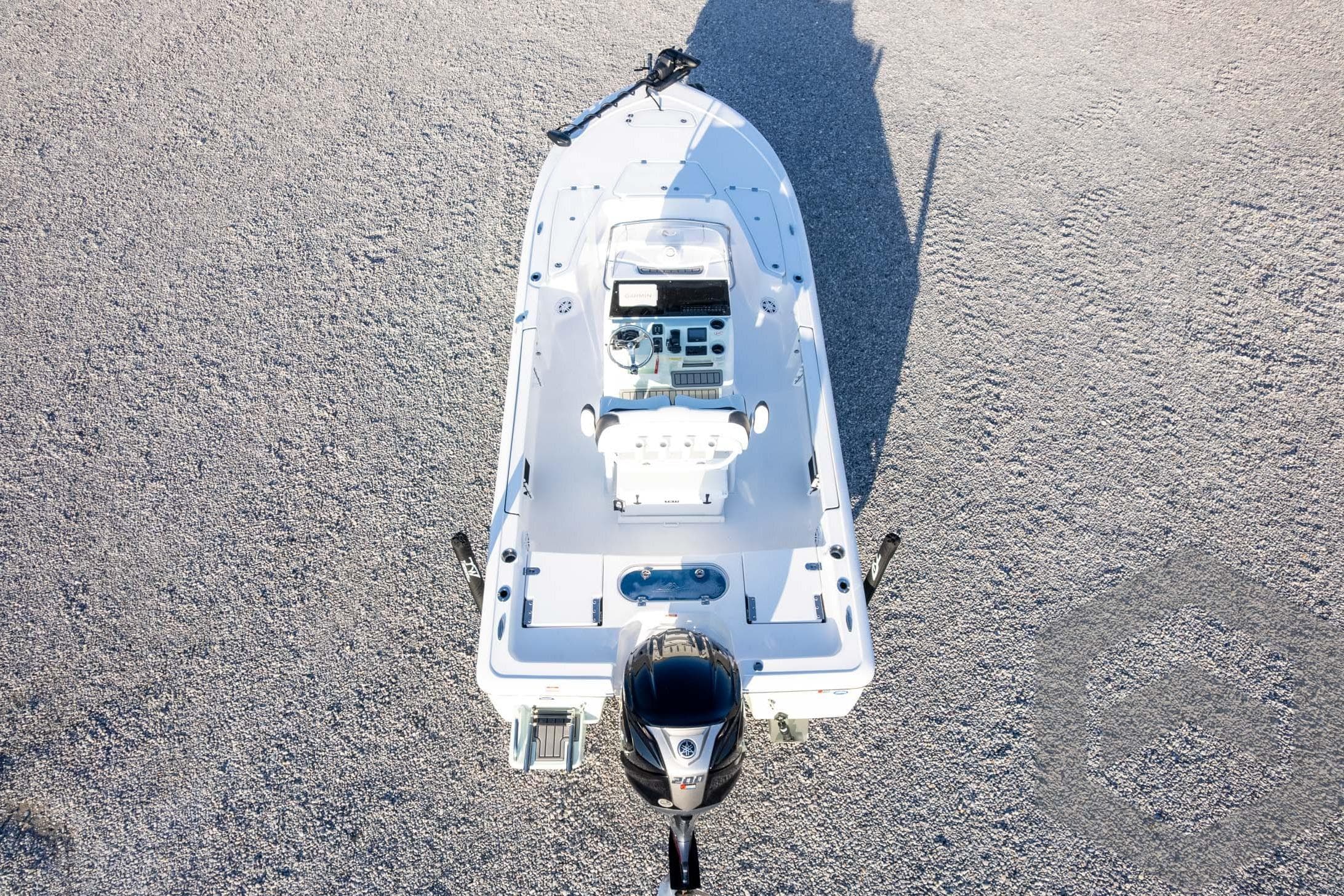 Overhead view of 2026 Tidewater 2110 Bay Max boat on gravel surface.