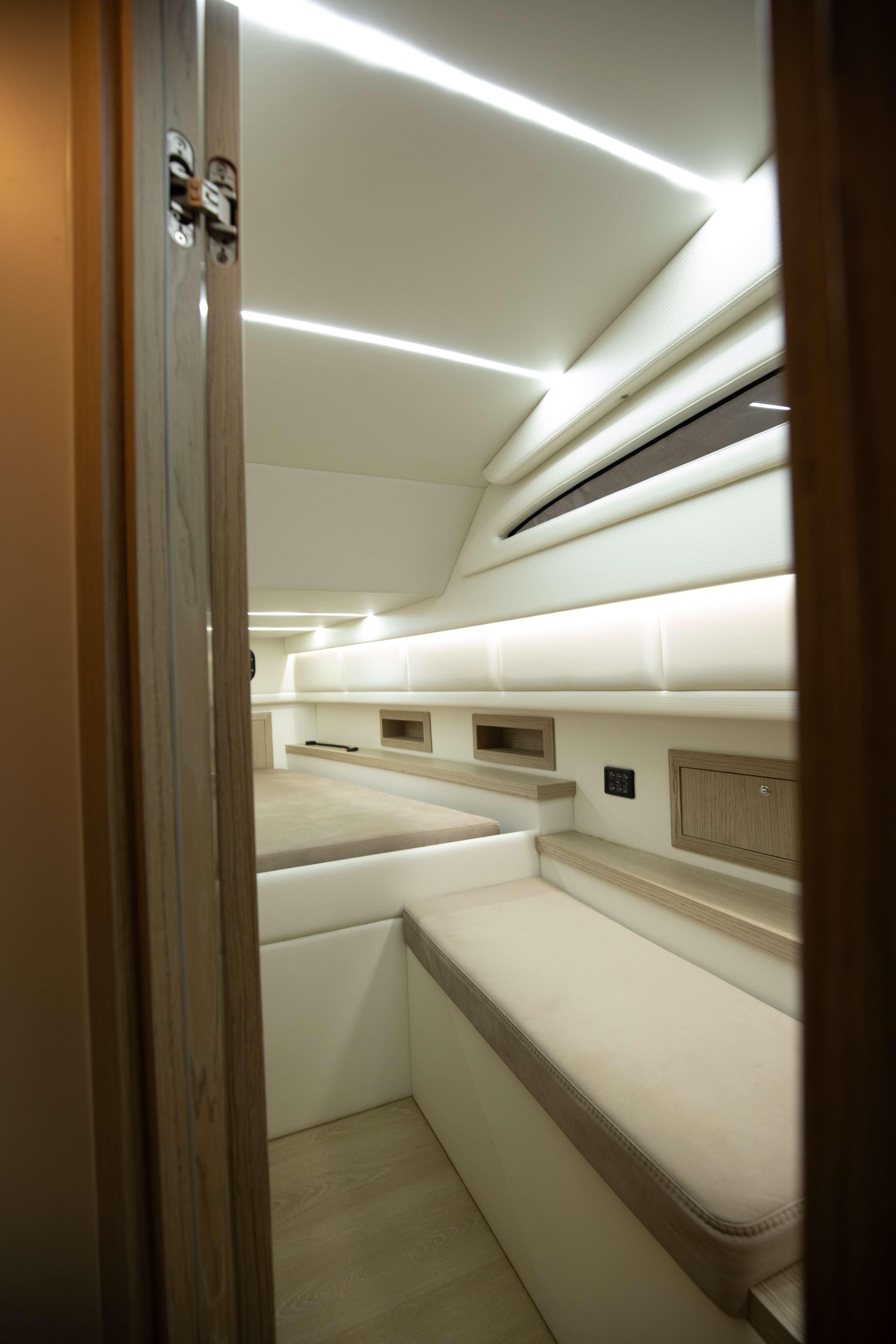 2024 Technohull Omega 47 cabin interior with modern lighting and sleek design.