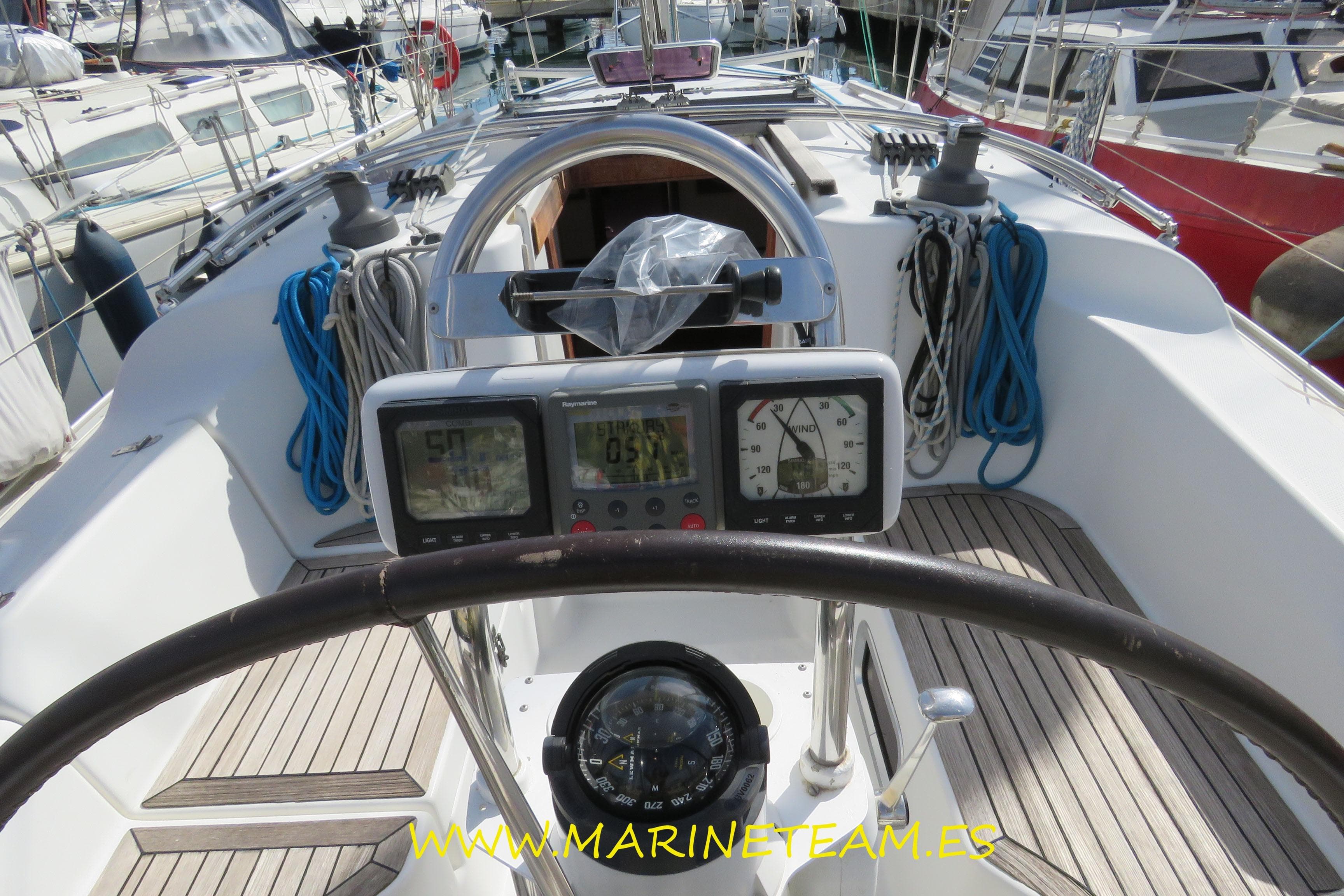 Cockpit view of 2007 Hanse 342 sailboat with navigation instruments and steering wheel.