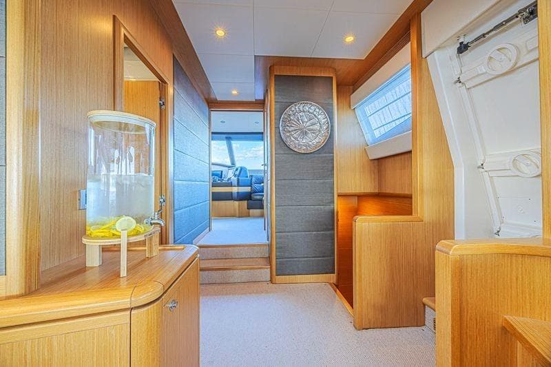 Luxurious interior of 2011 Ferretti Yachts 830 with elegant wood finishes and modern decor.