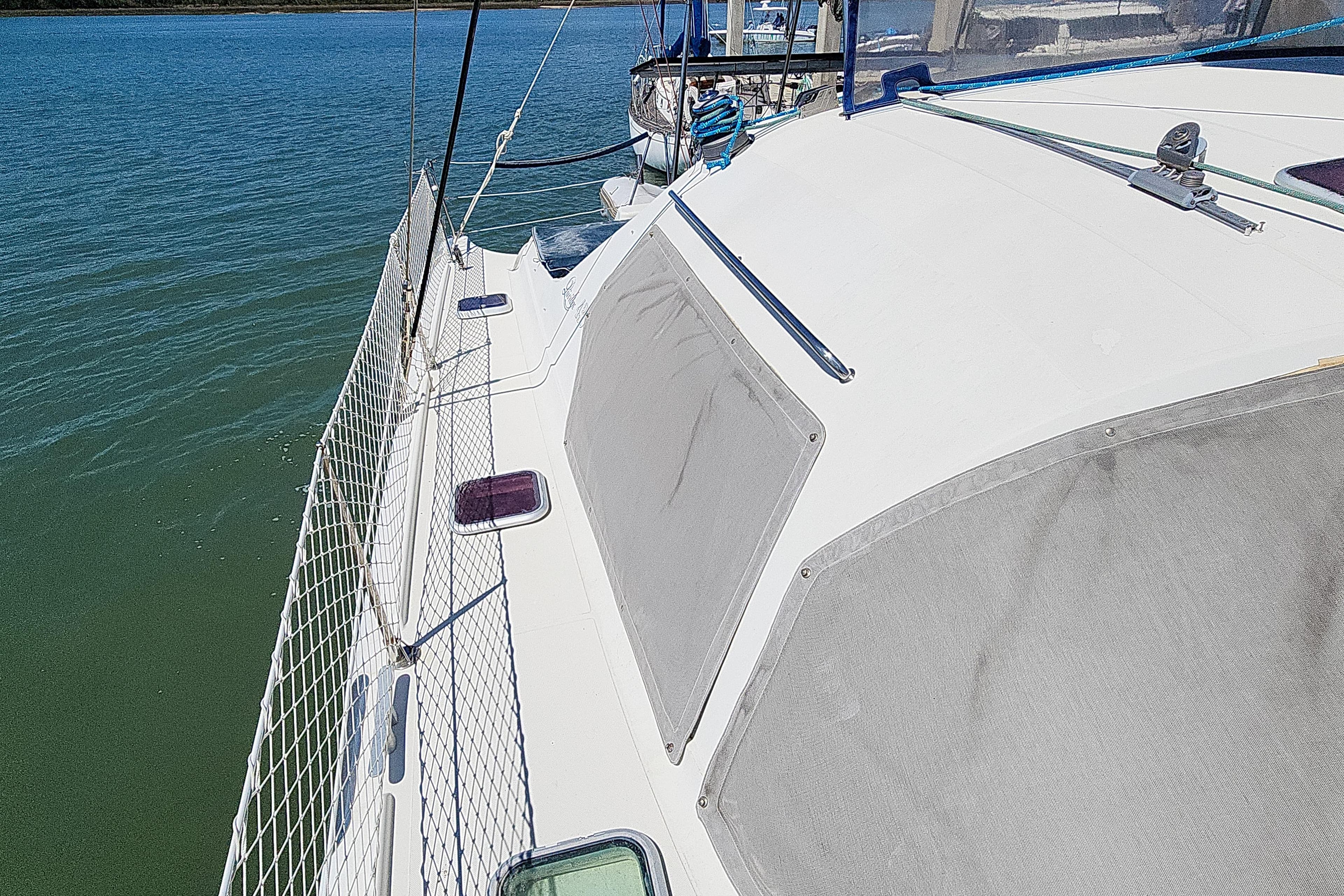 Sailing yacht Privilege 435, 2001 model, docked on calm waters.