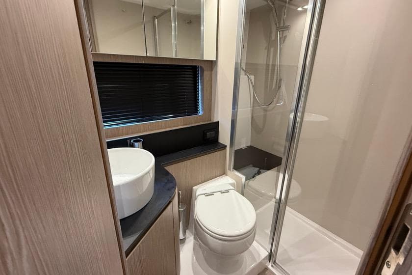 Luxurious bathroom in 2023 Azimut Atlantis 45 yacht with modern fixtures and shower.