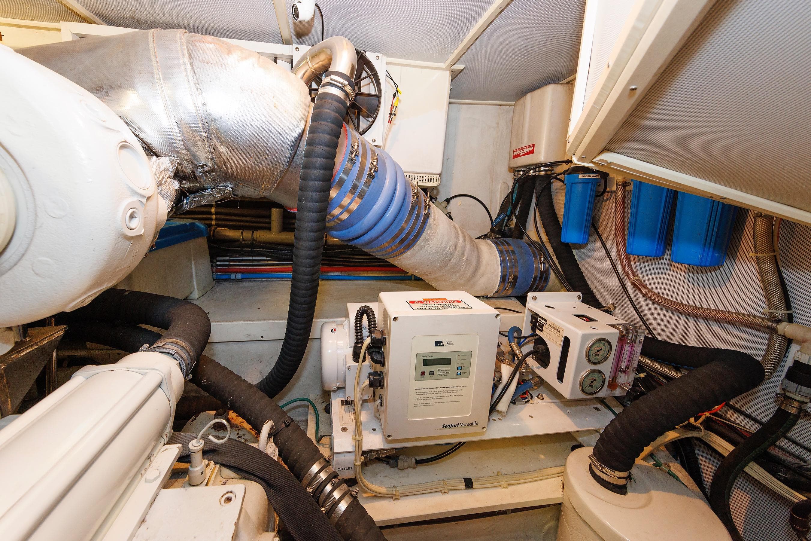 Engine room of 2009 Hunt Yachts 52 Express, showcasing mechanical components and systems.