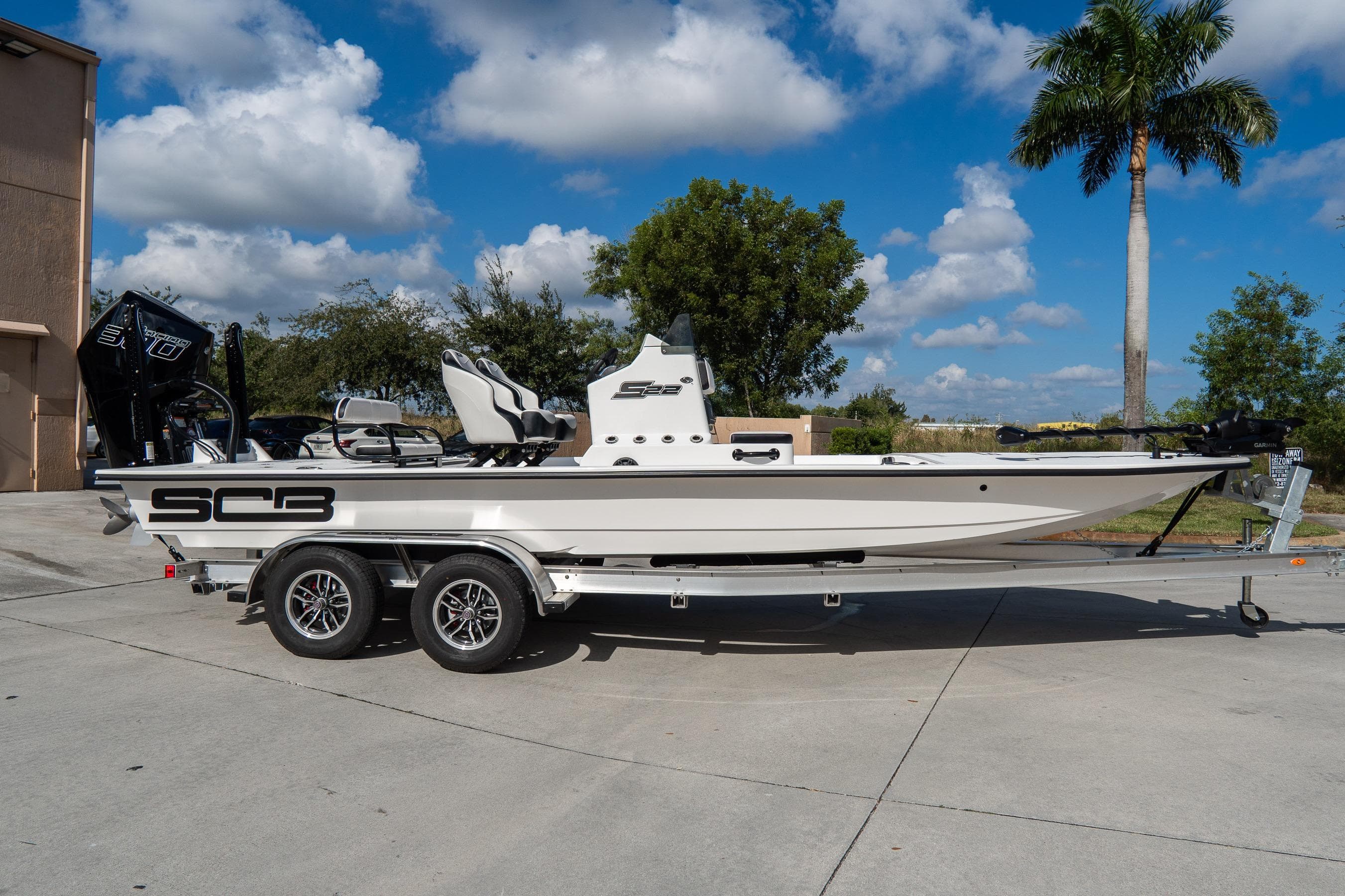 2026 SCB S22 boat on trailer, parked outdoors under a blue sky.