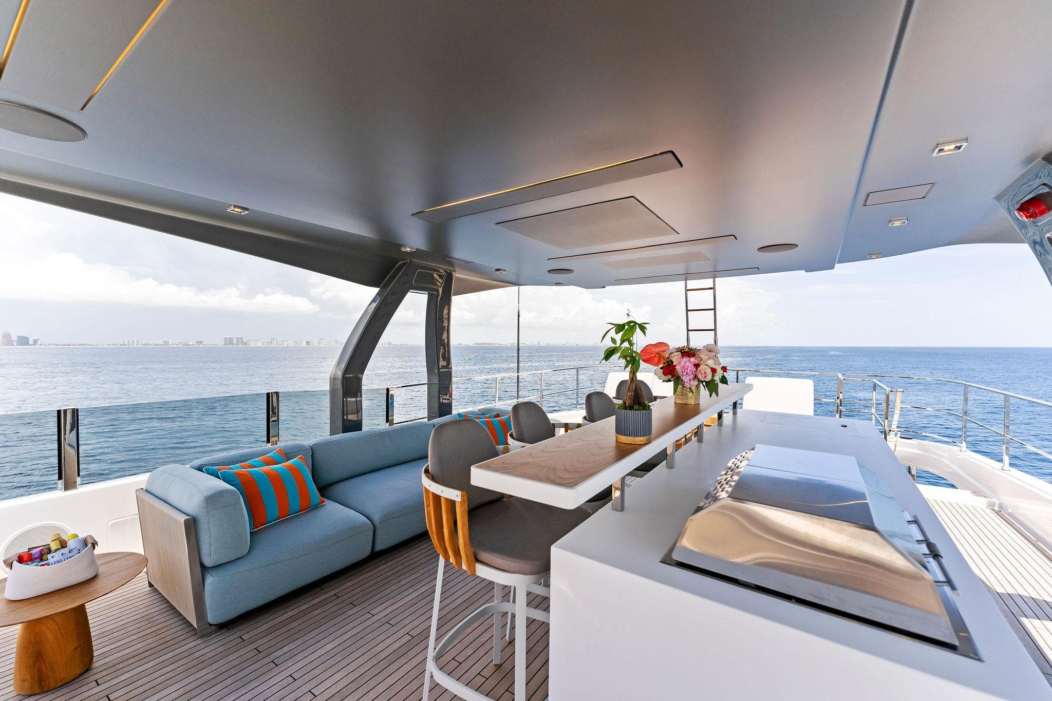 Luxurious 2024 Custom Line Navetta 33 yacht interior with modern seating and ocean view.