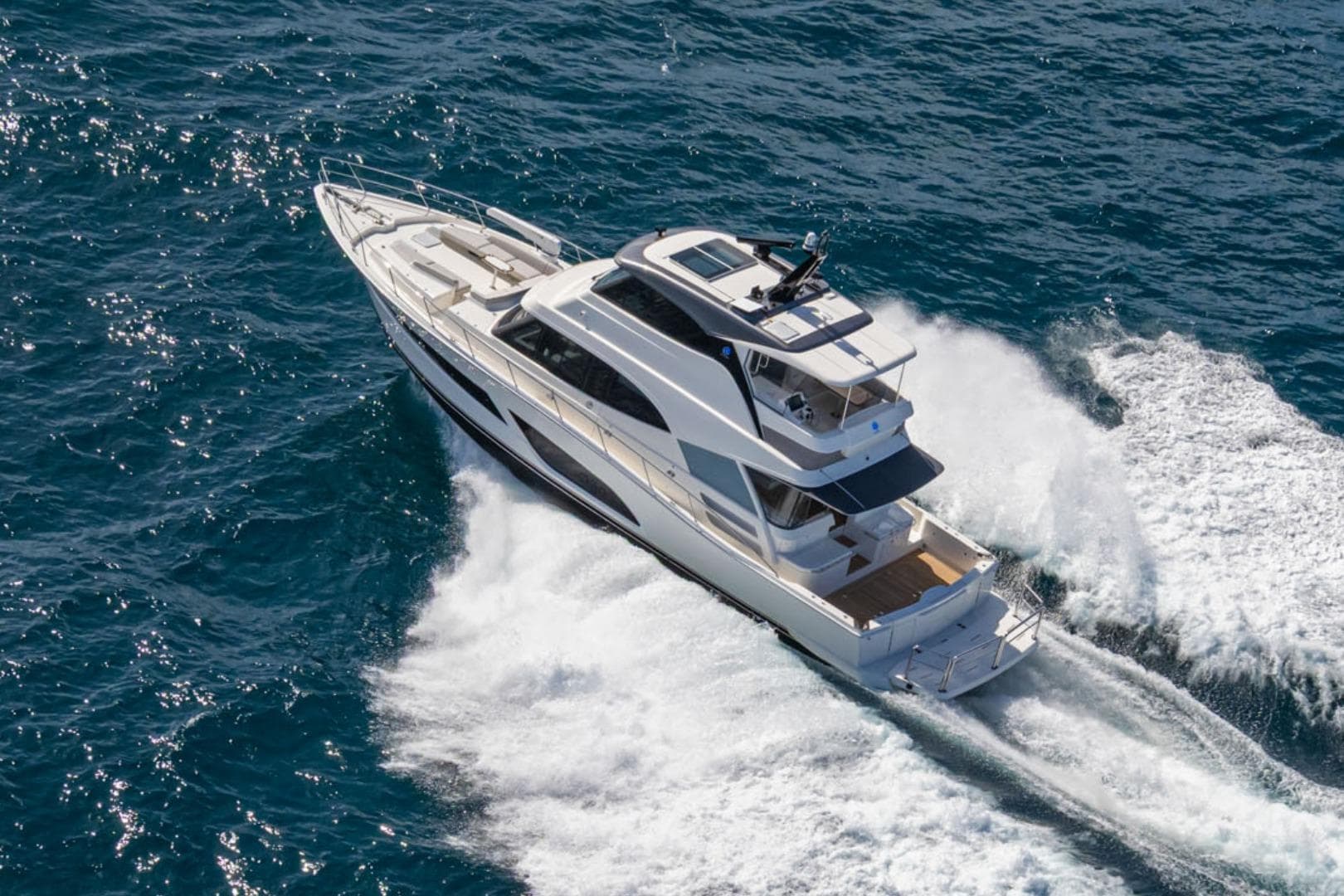 2026 Riviera 64 Sports Motor Yacht Series II cruising on open water.