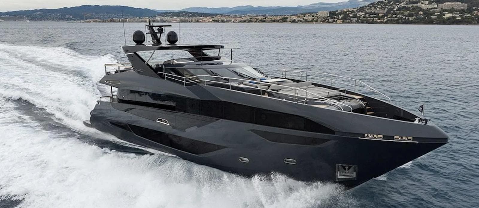 Luxurious 2023 Sunseeker 100 Yacht cruising on open water, showcasing sleek design and elegance.