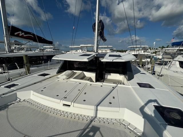 Leopard 50 catamaran, 2020 model, docked at marina under blue sky.