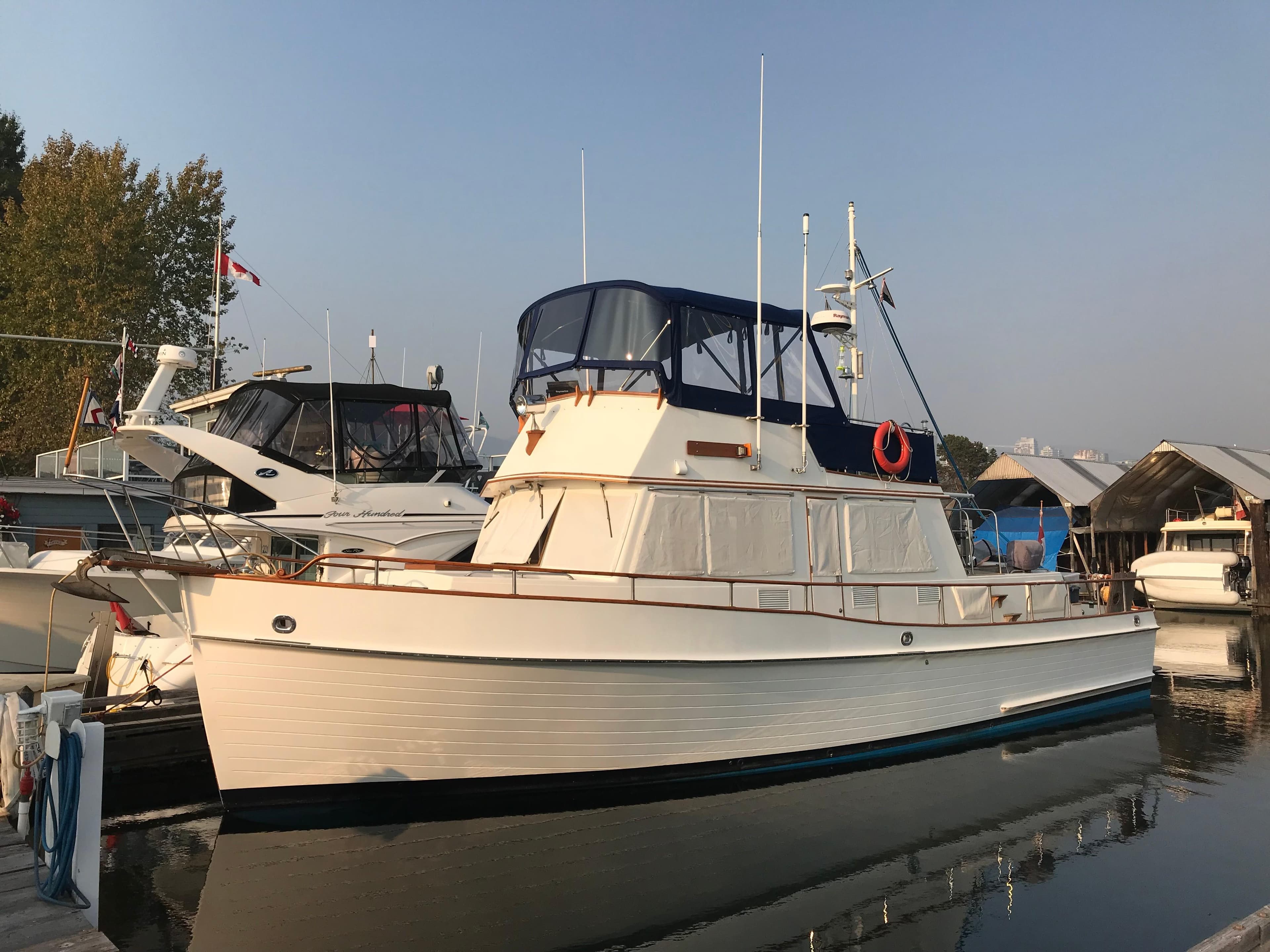 1983 Grand Banks 42 Classic yacht docked at marina.