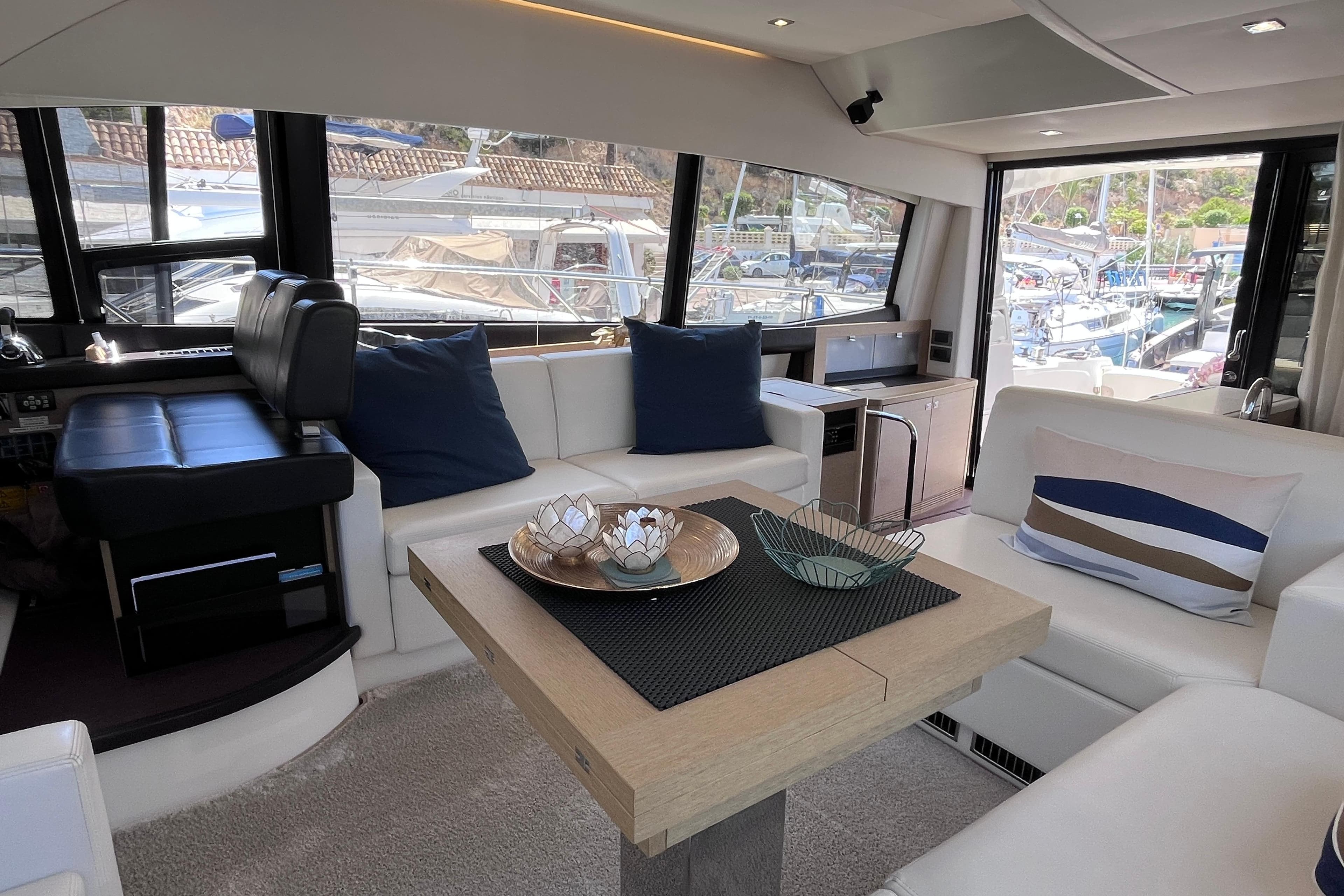 Luxurious interior of a 2018 Prestige 500 yacht with elegant seating and decor.