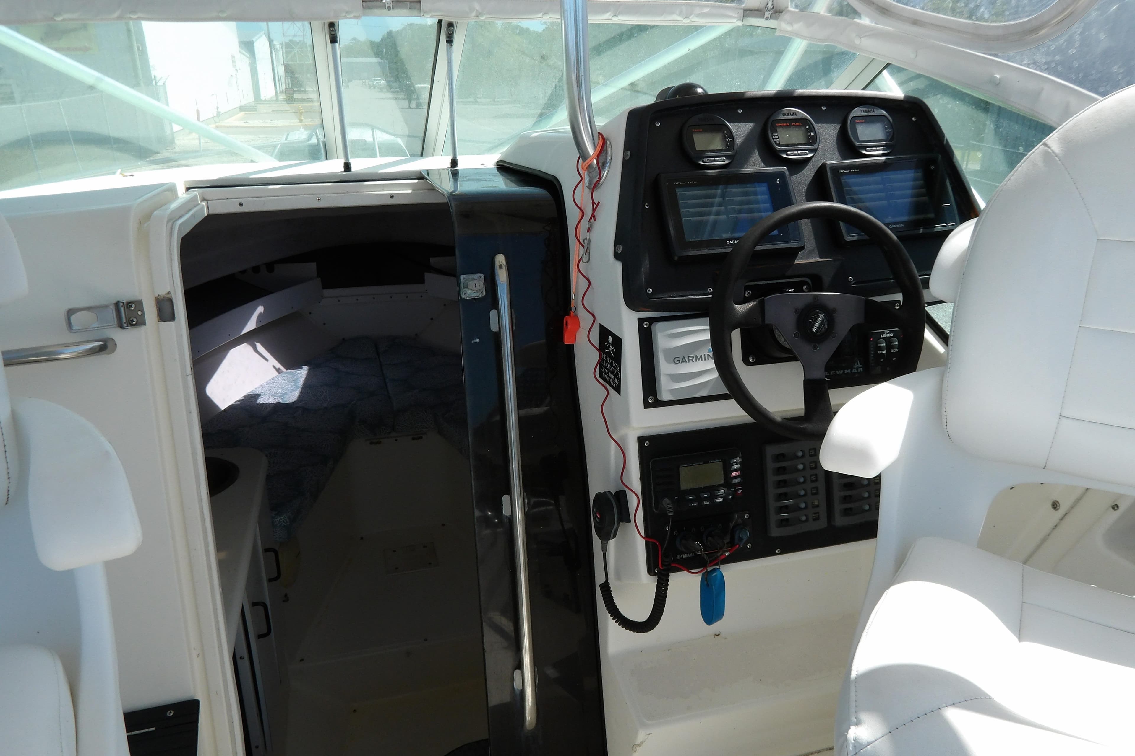 Interior of a 1993 Wahoo 2600 boat showing cockpit and cabin entrance.