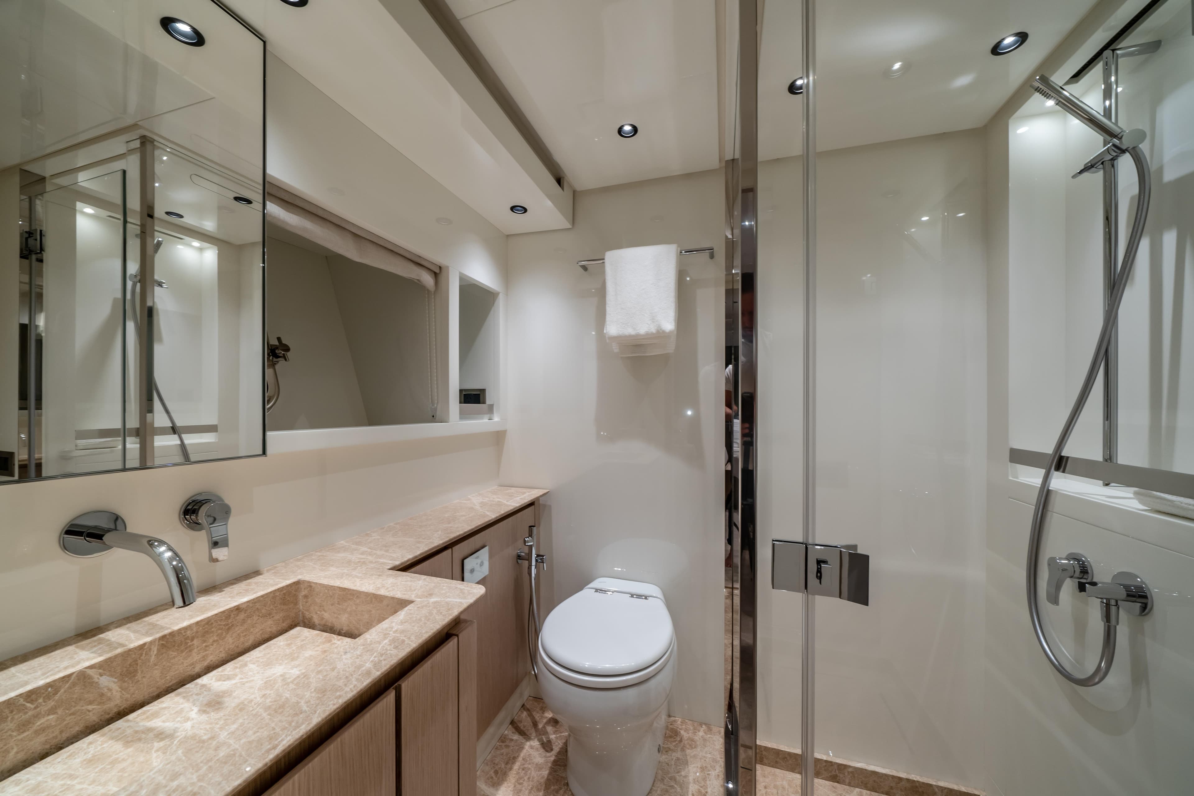 Luxurious bathroom in 2021 Sanlorenzo SX76 yacht, featuring modern fixtures and elegant design.