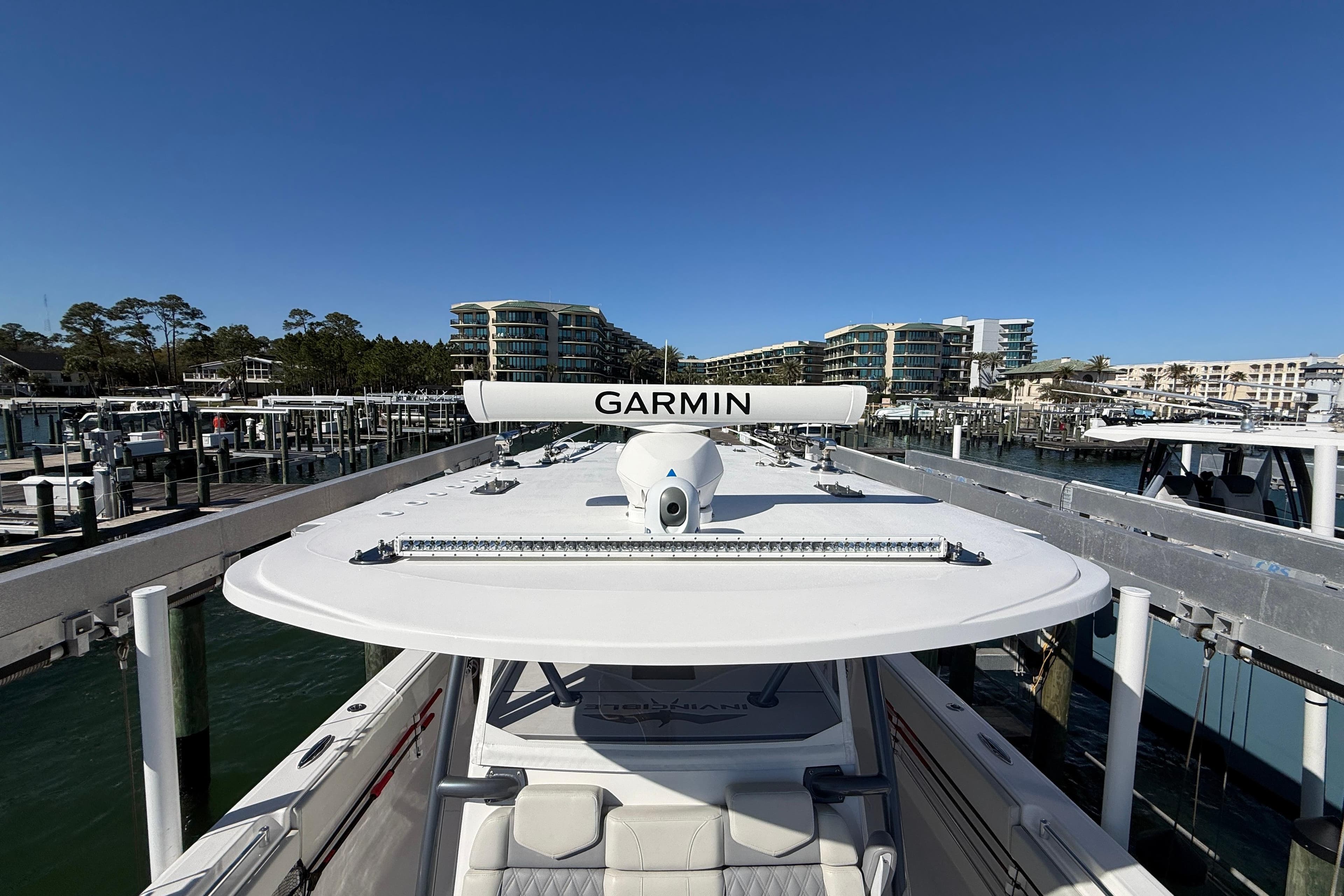 2022 Invincible 40 Catamaran with Garmin equipment docked at a marina.
