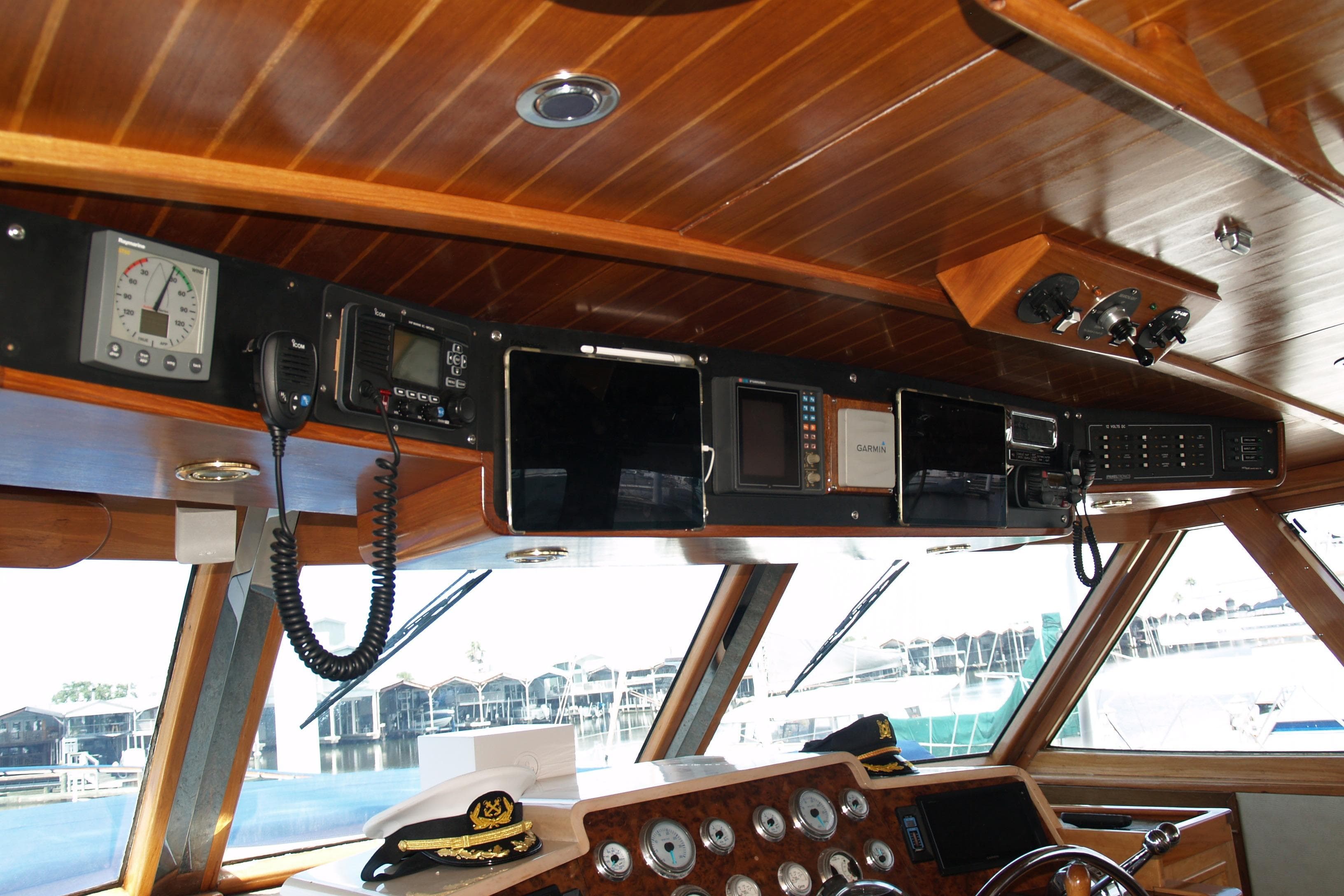 1964 Striker Cockpit interior with navigation instruments and wooden paneling.