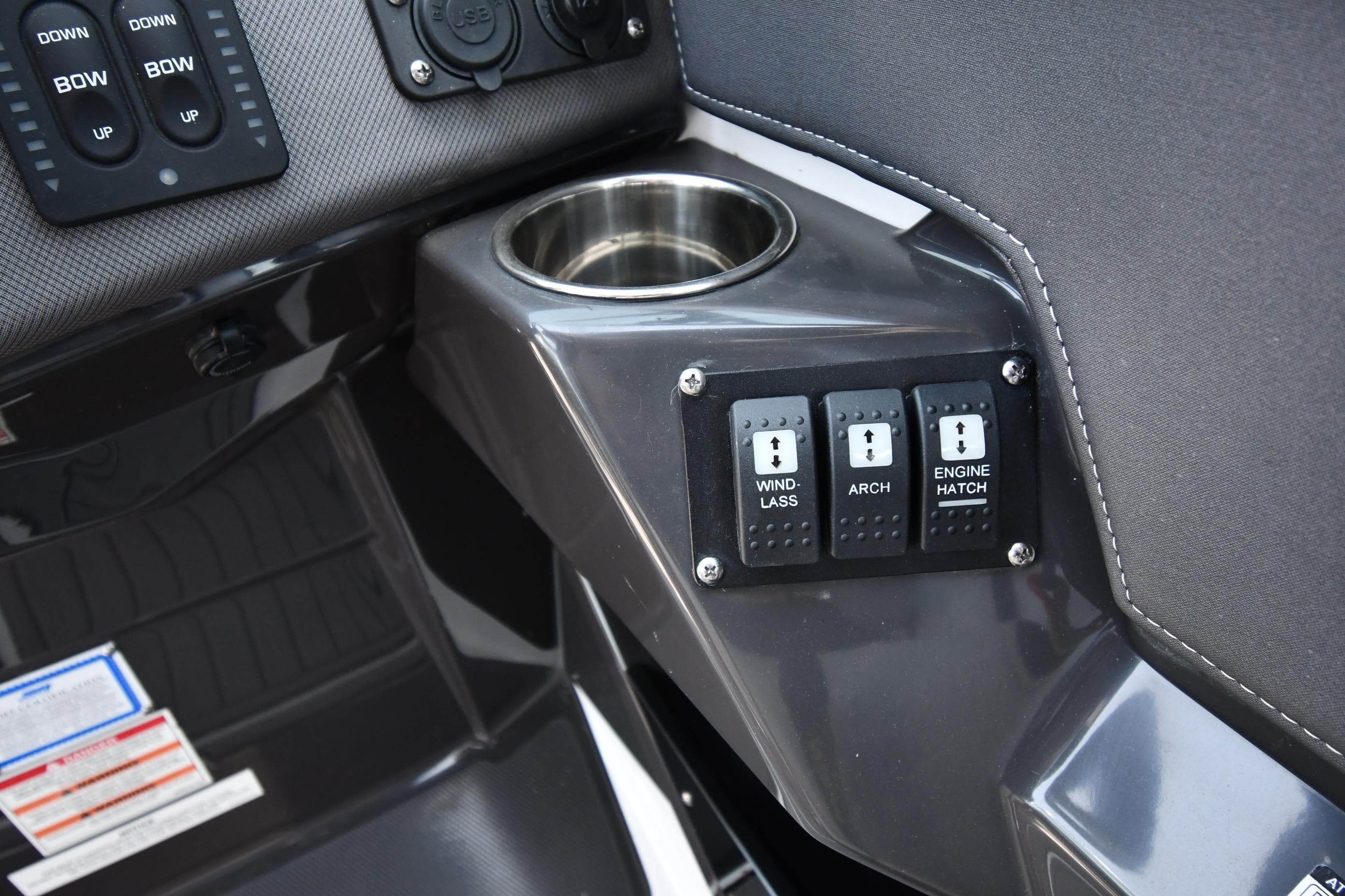 2021 Monterey 278 Super Sport boat control panel with cup holder and switches.