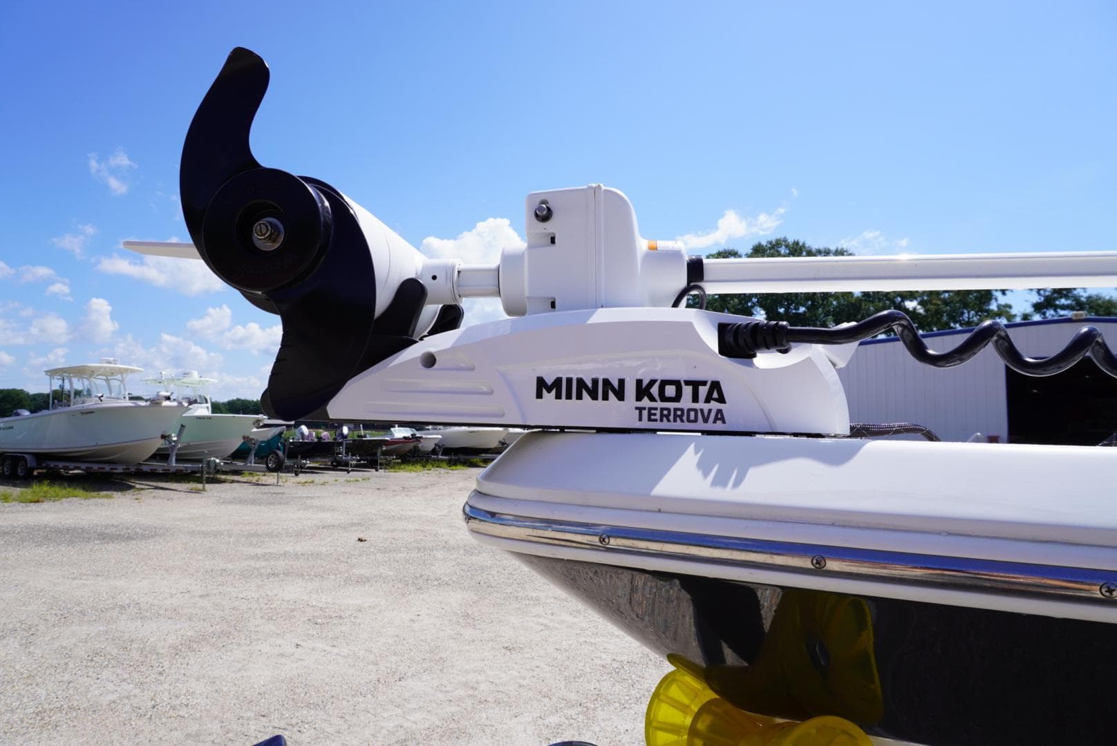Minn Kota Terrova trolling motor on 2014 NauticStar 244 XTS boat under clear blue sky.