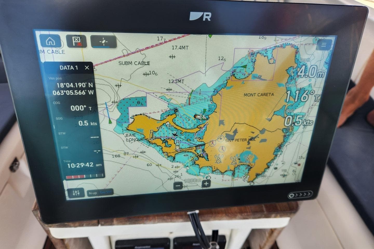 Navigation display on Bavaria 44 yacht, showing nautical chart and coordinates.
