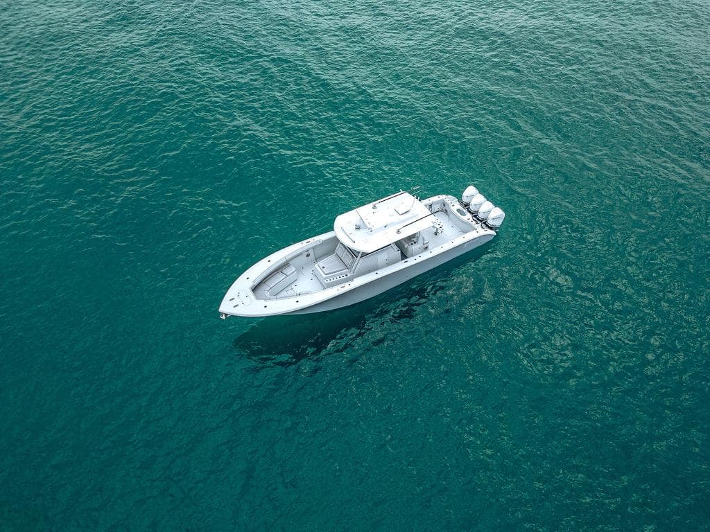 2019 Yellowfin 42 boat on clear blue water, aerial view.
