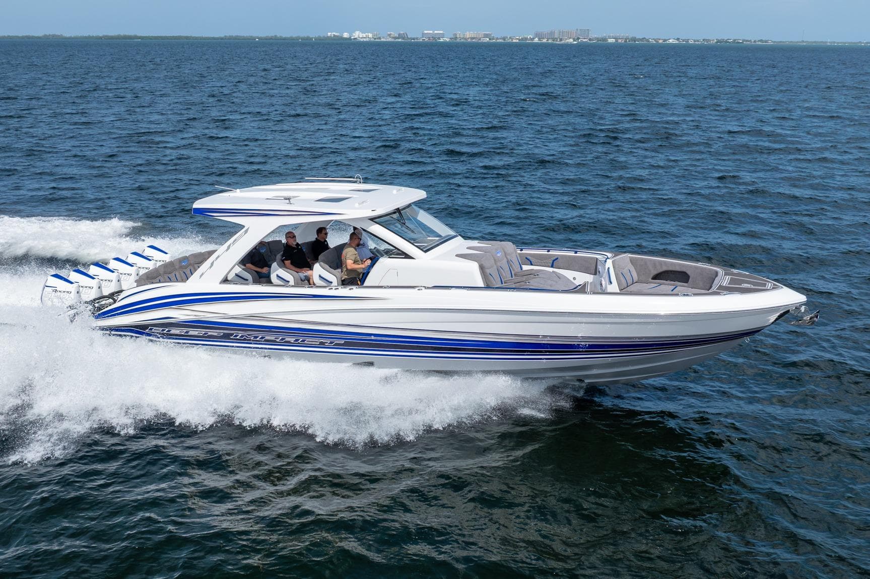 2027 Deep Impact 449 Sport boat cruising on open water, showcasing sleek design and powerful engines.