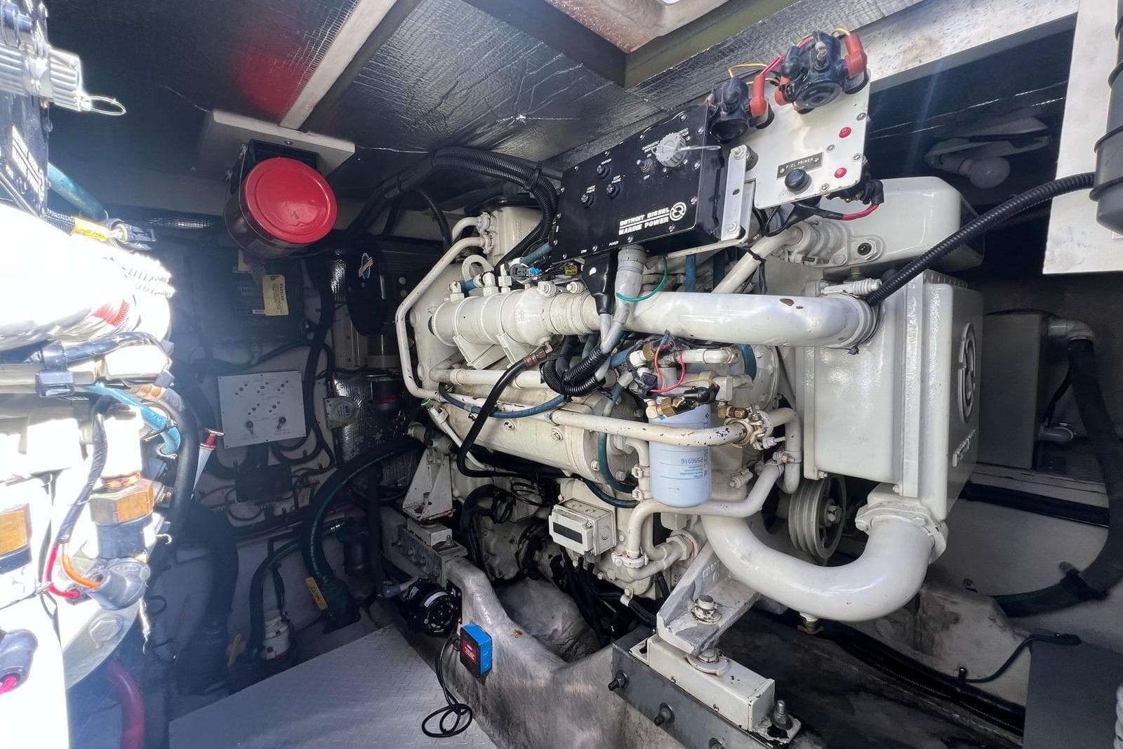 Engine room of a 1997 Sea Ray 500 Sundancer, showcasing detailed mechanical components.