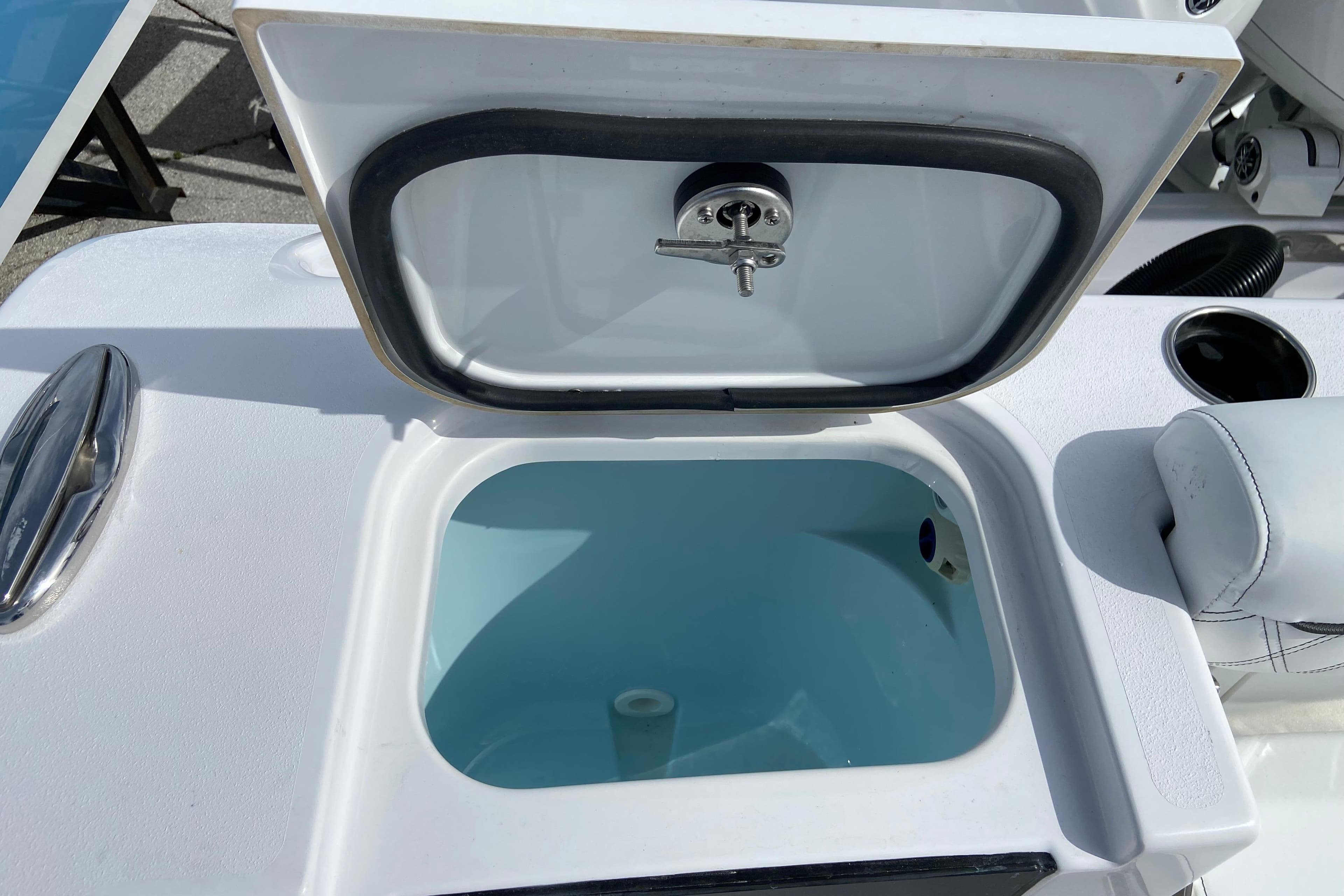 Open storage compartment on 2026 Sportsman Open 262 Center Console boat.