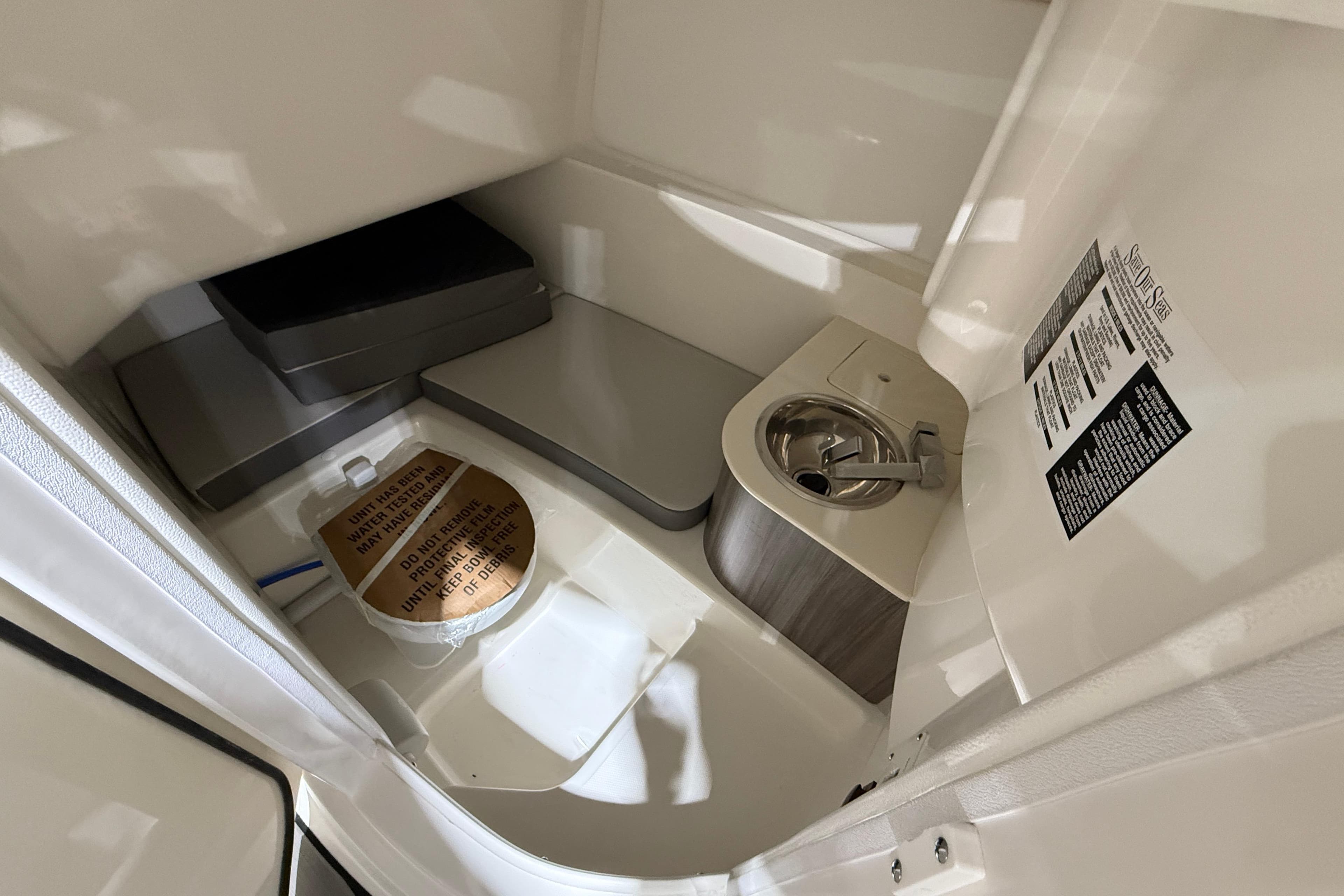 Interior of 2026 Sea Ray SDX 270 boat bathroom with sink and toilet.