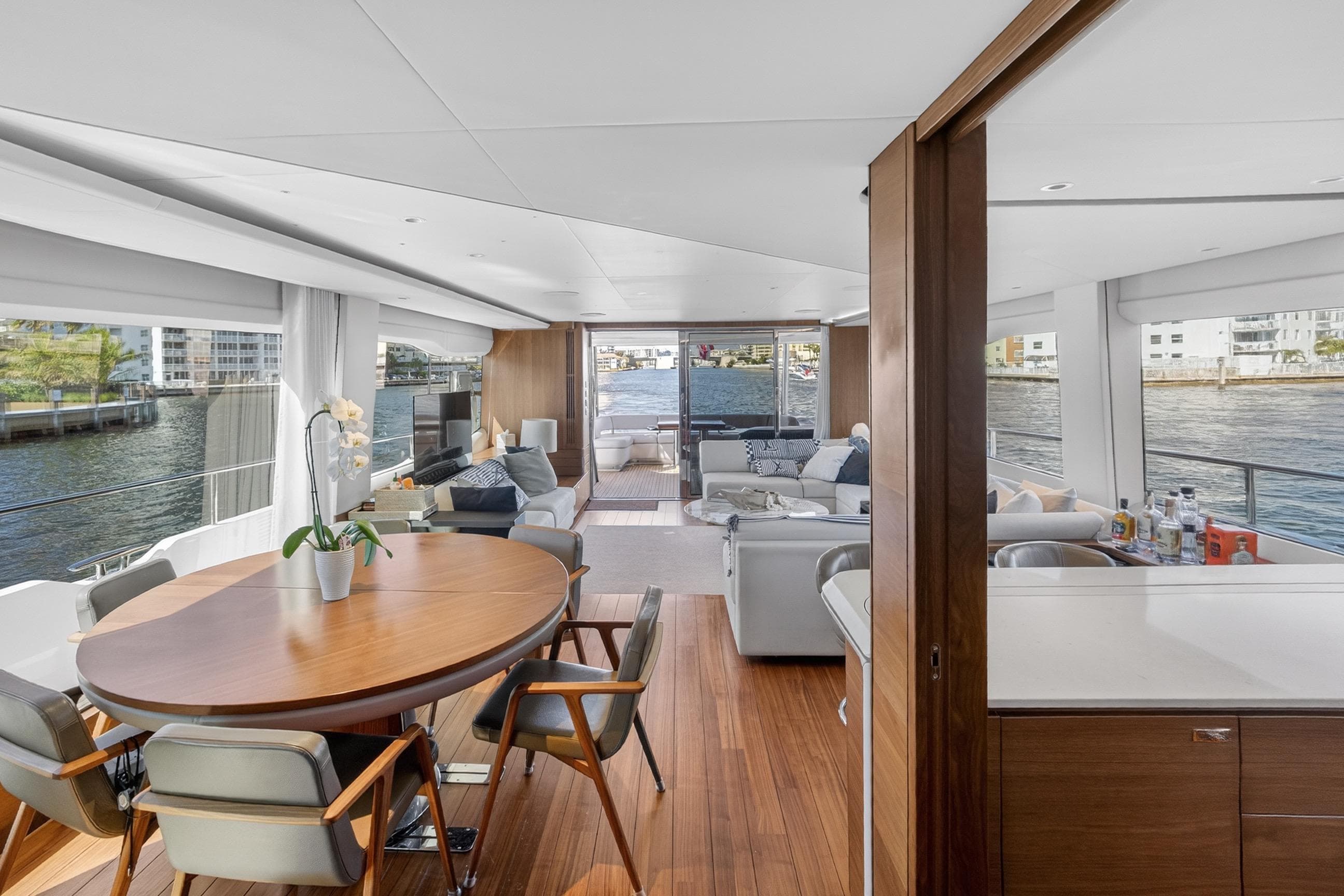 Luxurious interior of 2022 Princess Y85 yacht with elegant dining and seating areas.