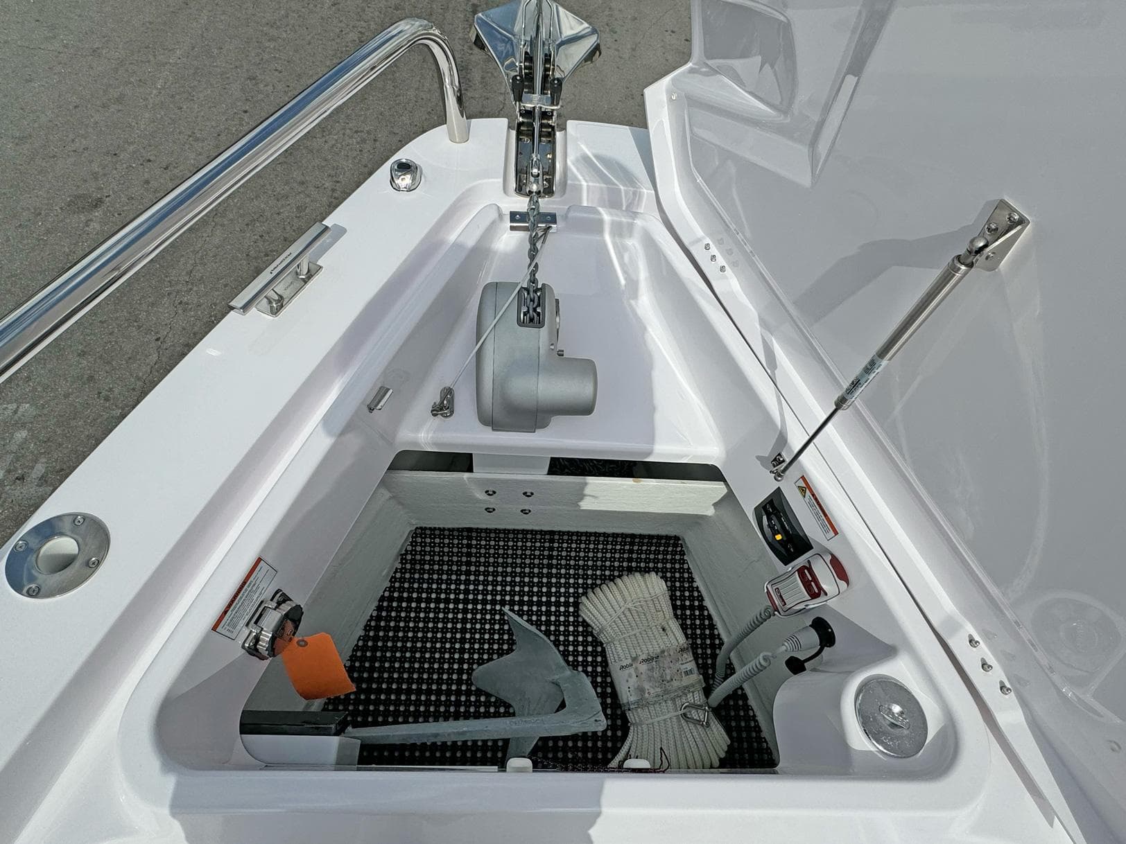 2024 Axopar 37XC CROSS CABIN anchor storage compartment with anchor and rope.