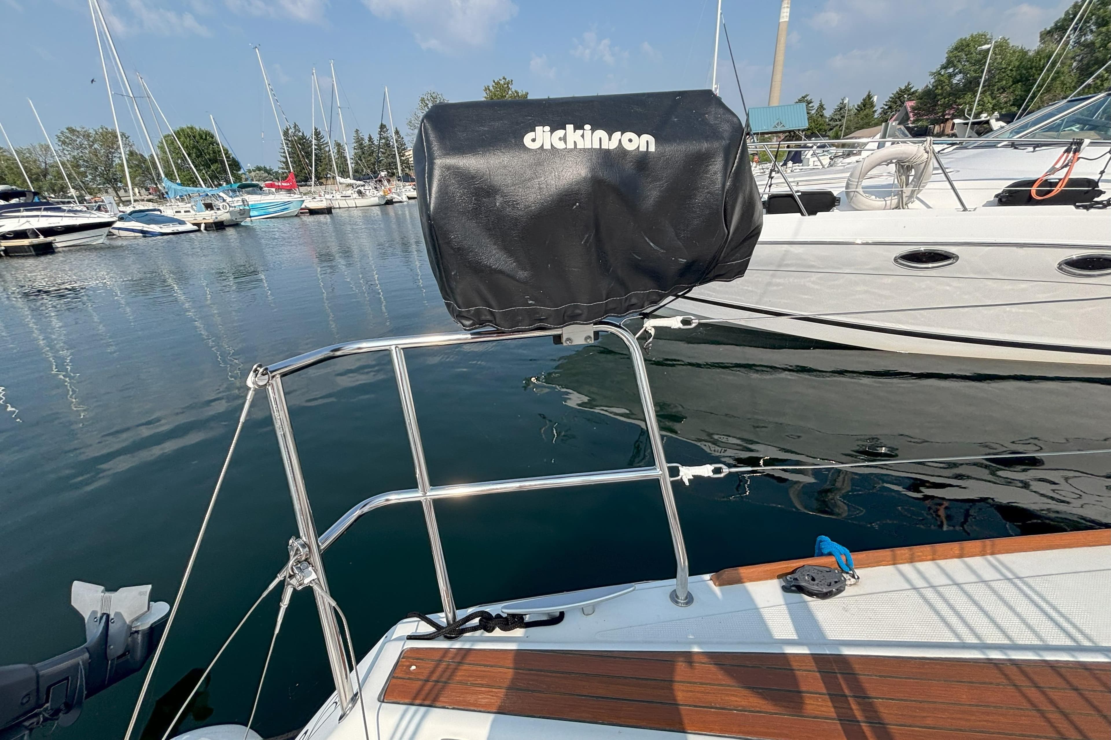 2008 Beneteau First 10R sailboat with covered grill, docked in a marina.