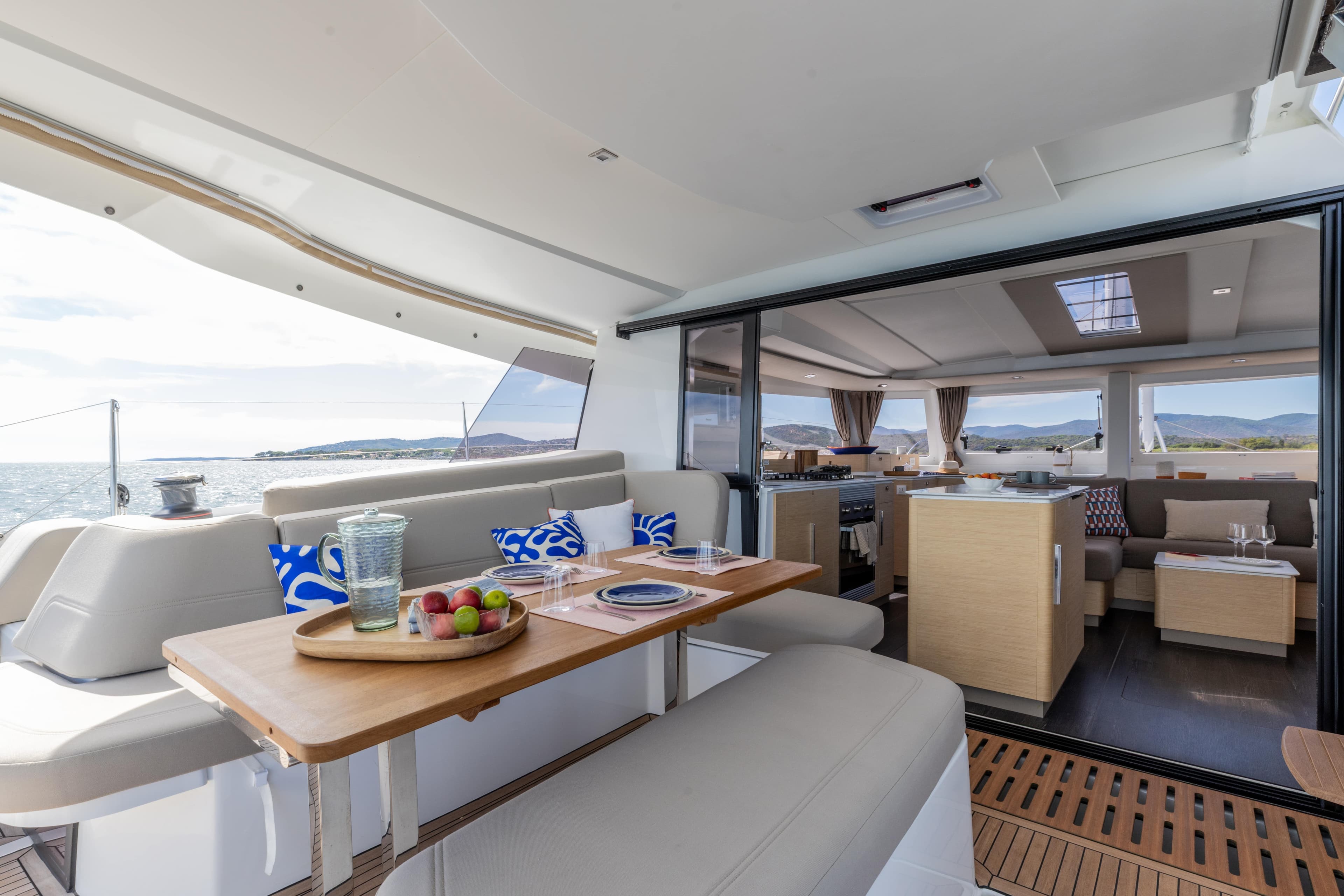 Luxurious 2026 Fountaine Pajot 44 yacht interior with elegant dining and lounge area.