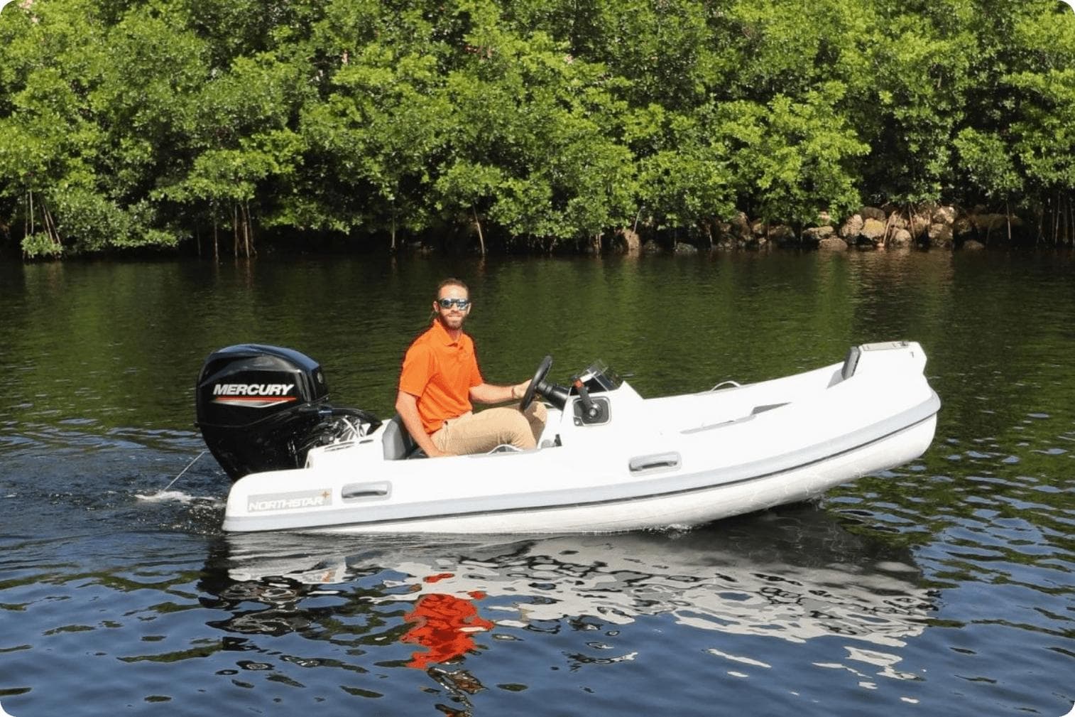2024 Northstar Axis 3.1 boat with Mercury engine on a calm river.