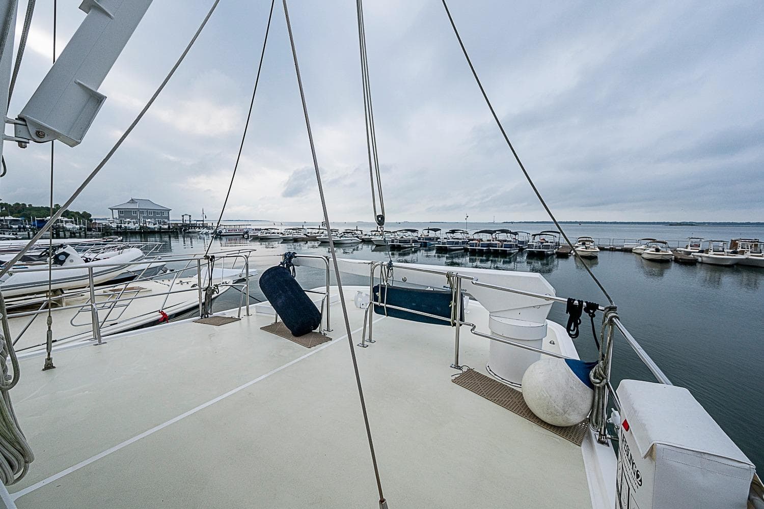 2008 Kadey-Krogen 48 North Sea yacht docked at a marina with overcast skies.