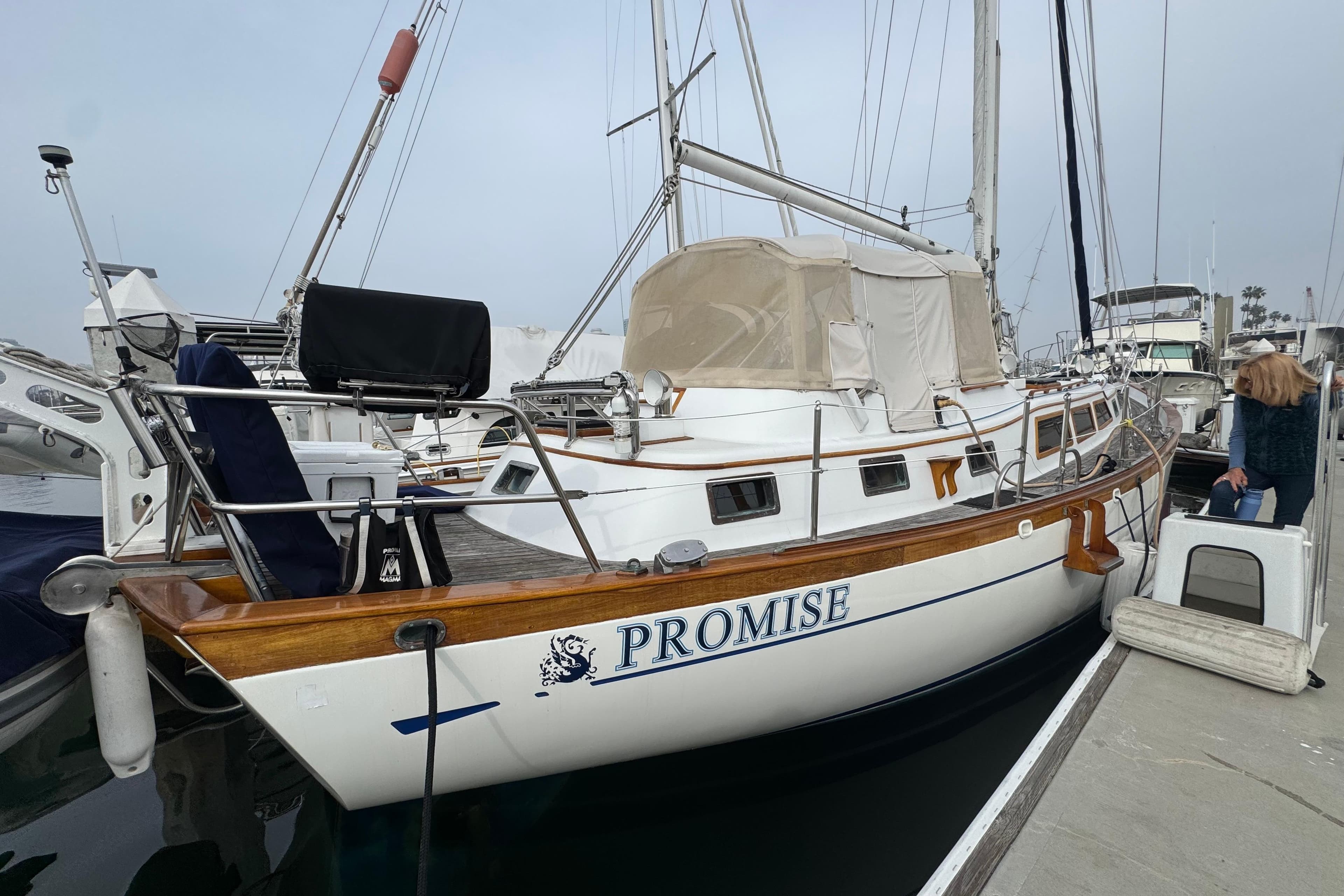 1978 Robert Perry 47 sailboat named "Promise" docked at a marina.