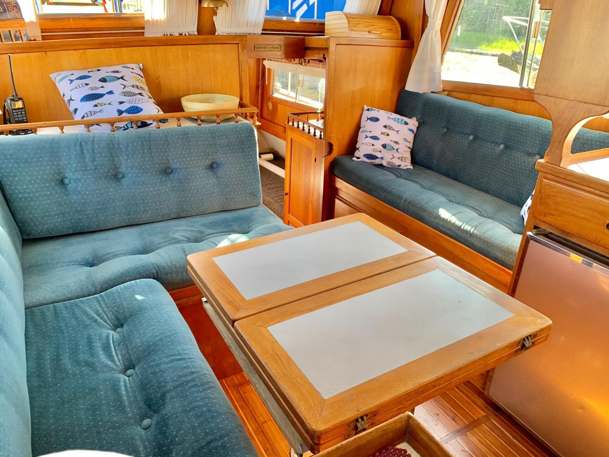 Interior of a 1978 CHB 34 Tri Cabin with blue upholstery.