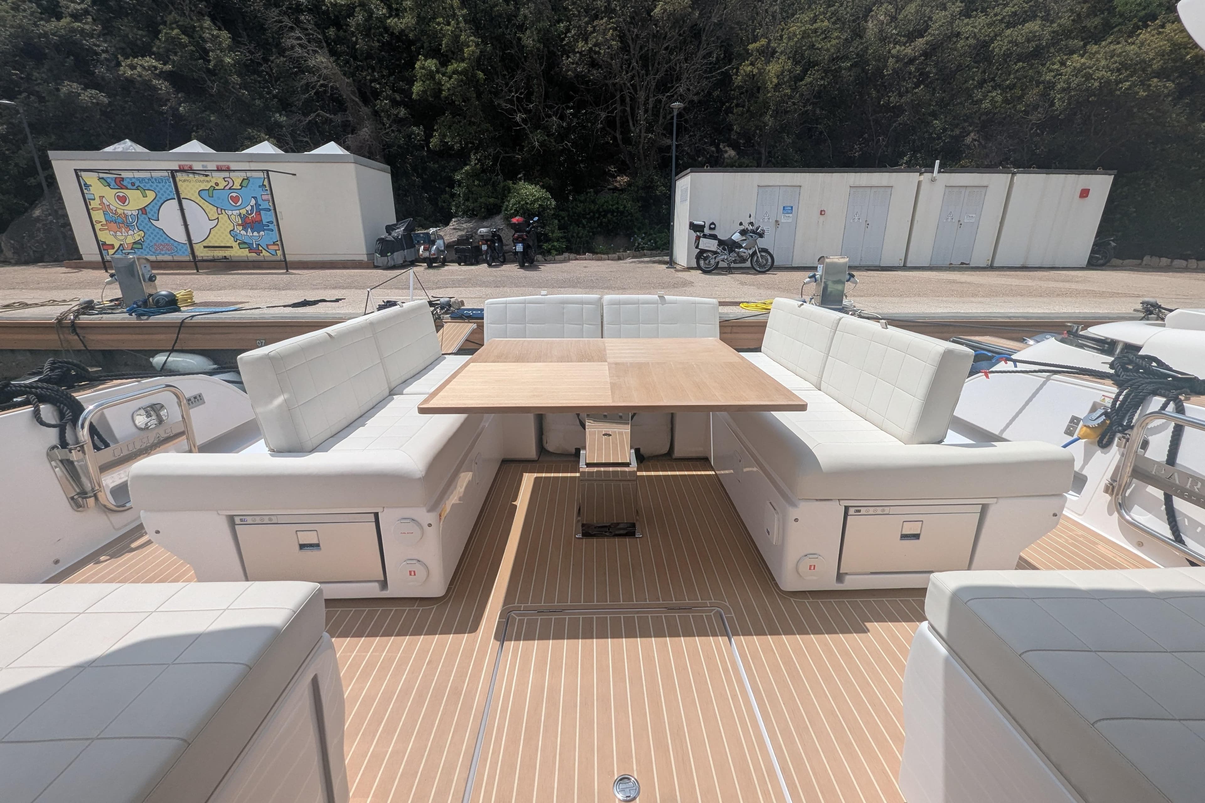 Luxurious 2024 Pardo Yachts GT52 deck with elegant seating and wooden table.