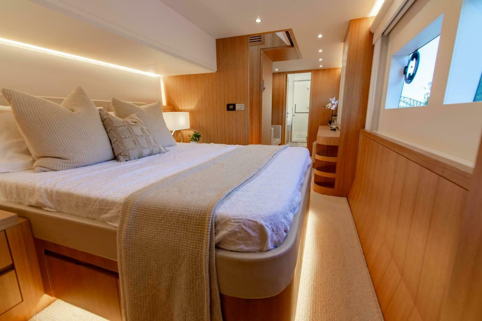 Luxurious bedroom interior on ILIAD 53E yacht, featuring modern design and ambient lighting, 2026 model.