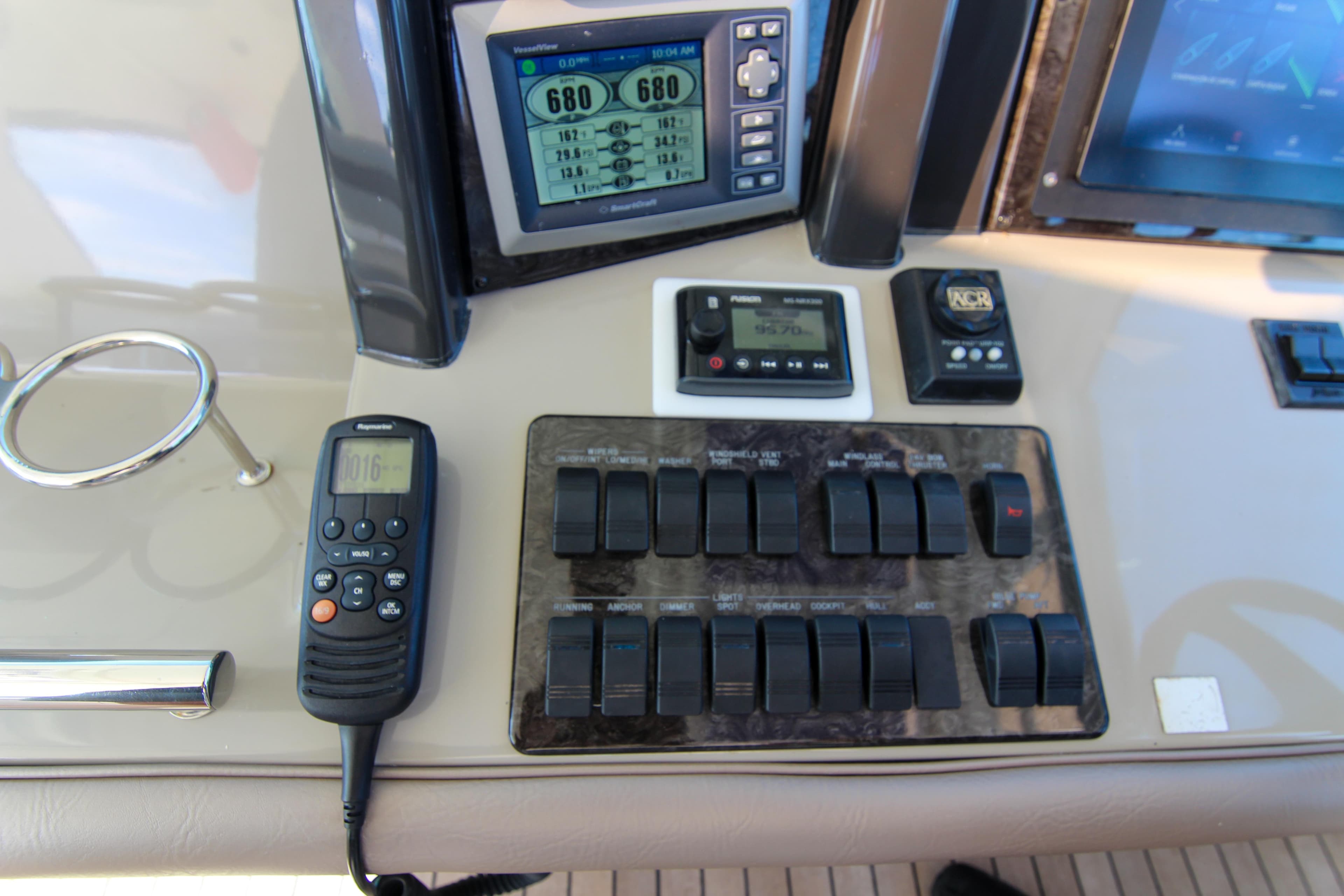 Control panel of a 2008 Sea Ray 48 Sundancer yacht with navigation instruments.