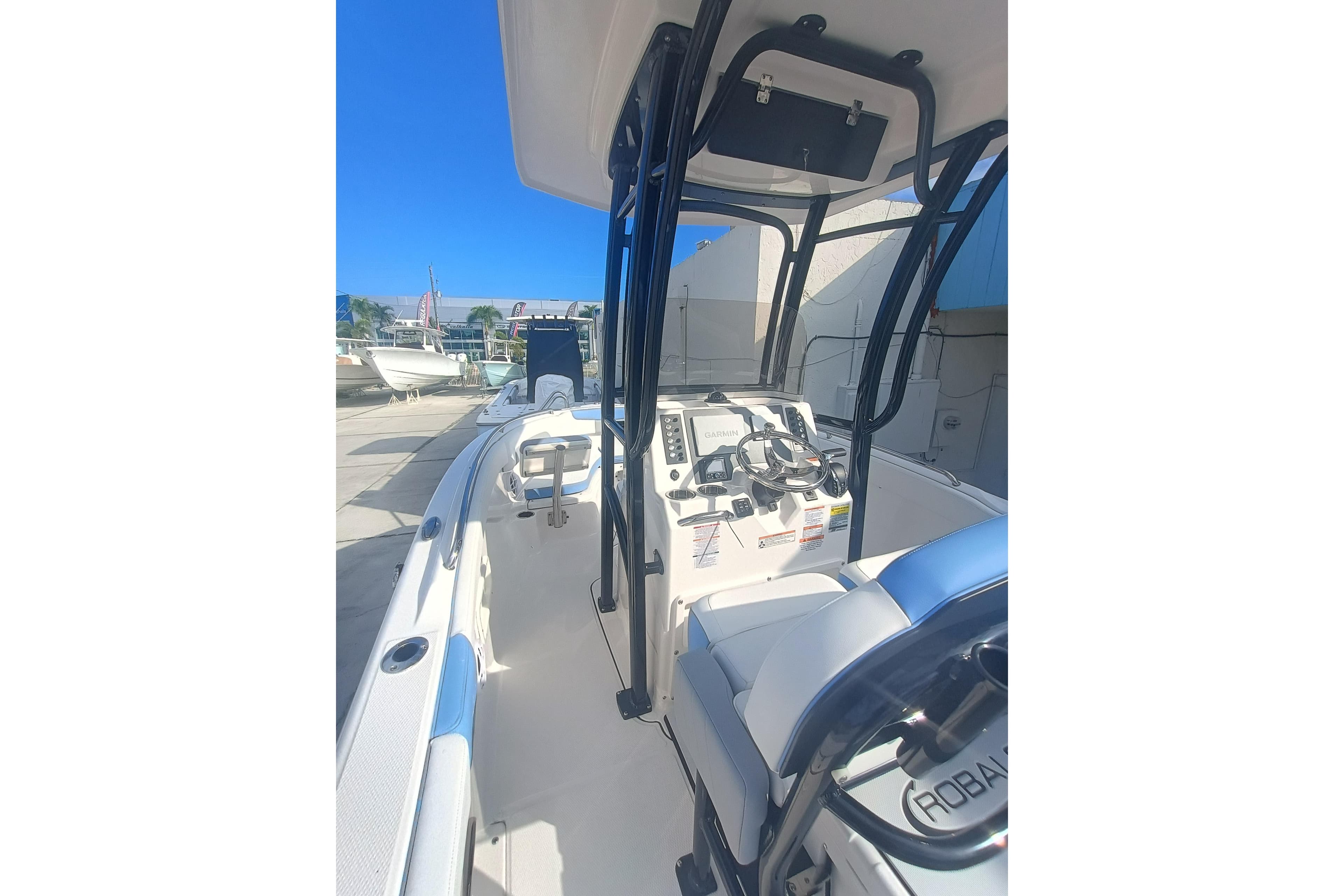 2026 Robalo R222 Explorer boat interior with steering console and seating.