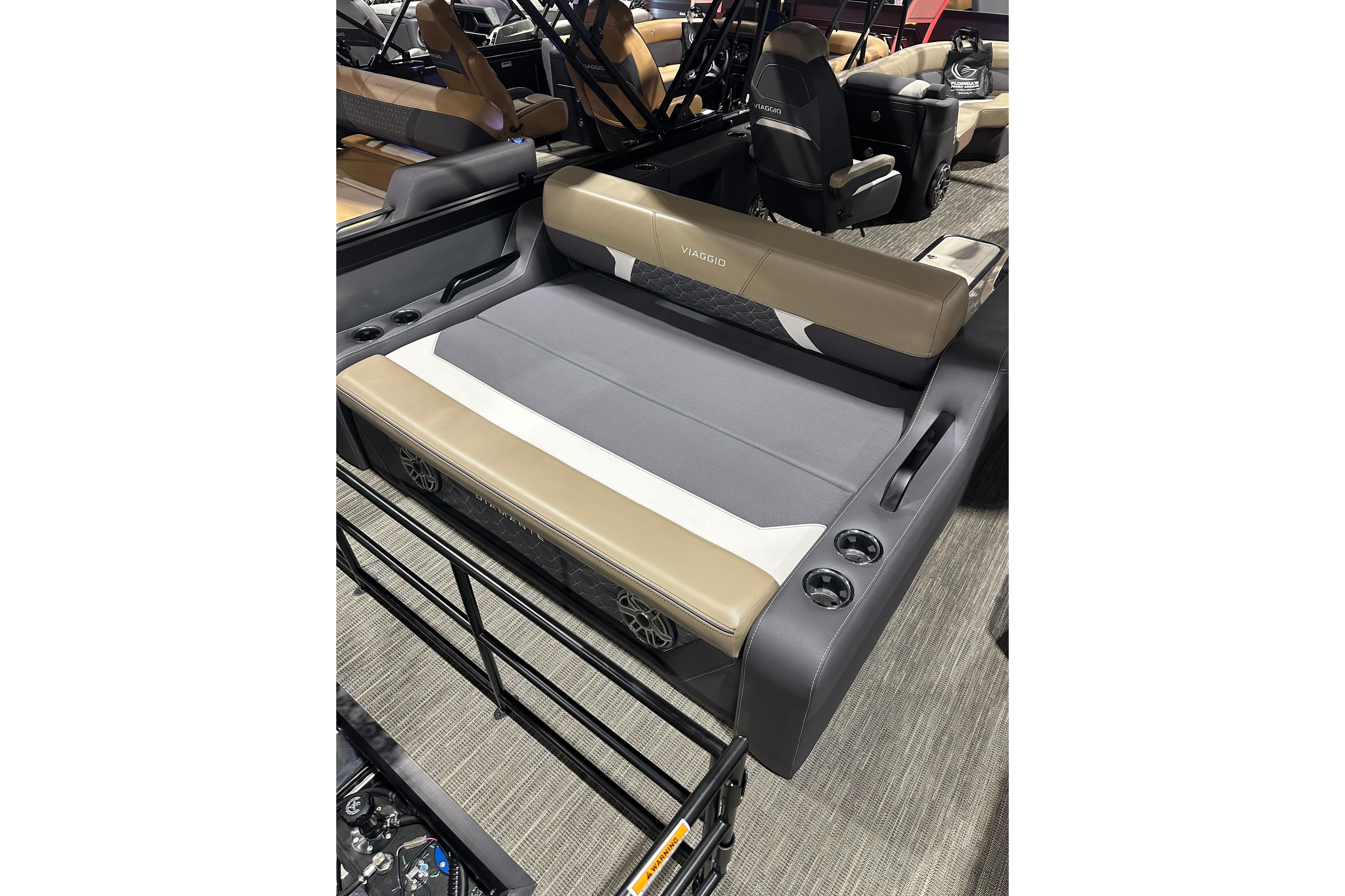 2026 Viaggio Diamante D22S boat interior with beige and gray seating, cup holders, and modern design.